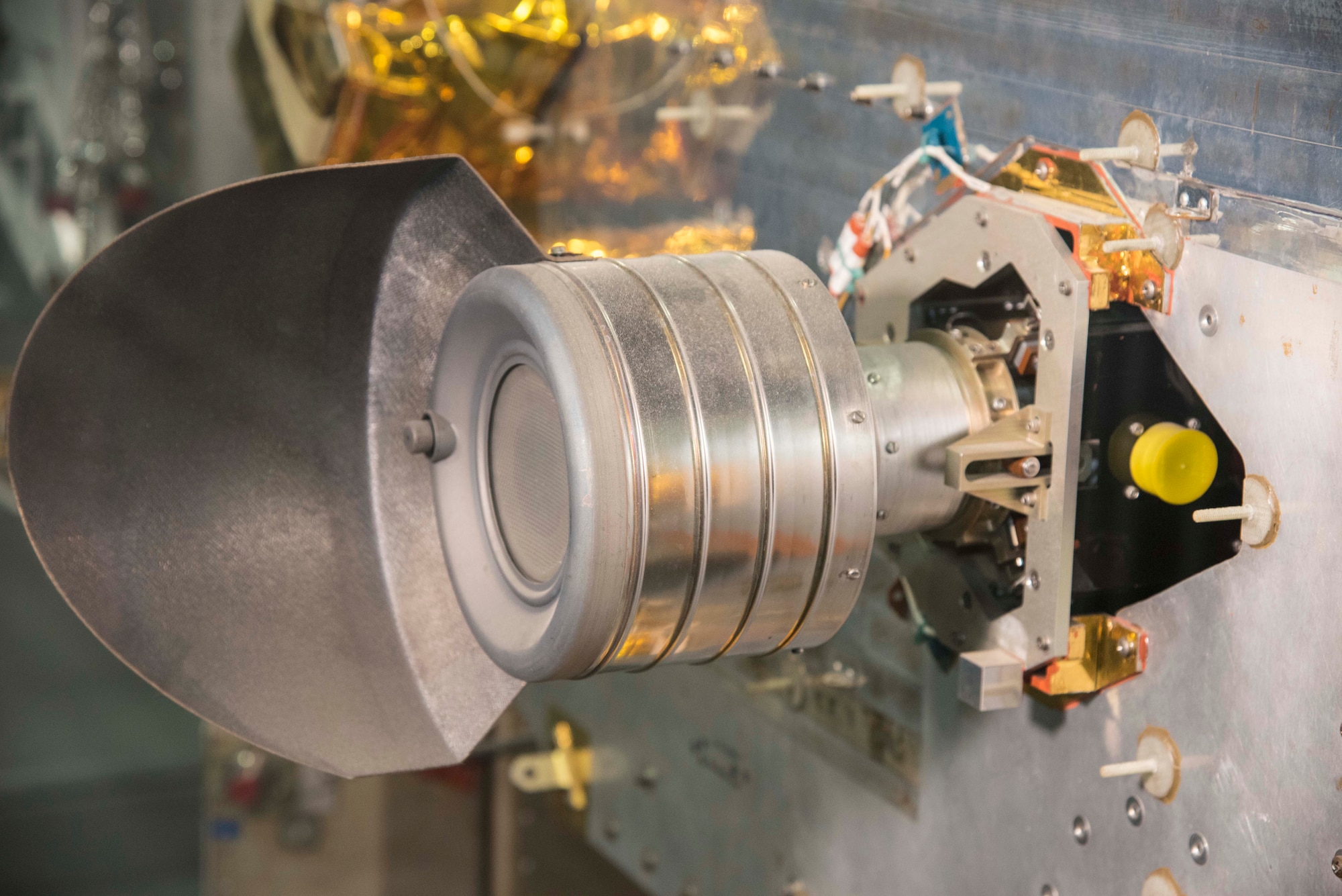 NASA Lewis (now Glenn) Researcher Center in Cleveland, OH, developed this ion thruster to help USAF spacecraft like P80-1 stay precisely positioned in space. The powerful lightweight thruster is electrical instead of a chemical rocket, and is powered by mercury. (U.S. Air Force photo by Ken LaRock)