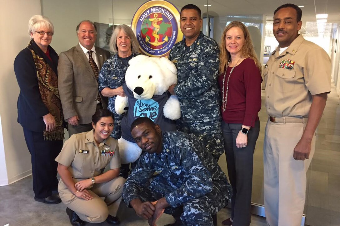 Personnel at the Navy Bureau of Medicine and Surgery headquarters in Falls Church, Va., pose for a photo upon reaching their 2016 Combined Federal Campaign goal, Dec. 1, 2016. Navy photo by Mariah Felipe