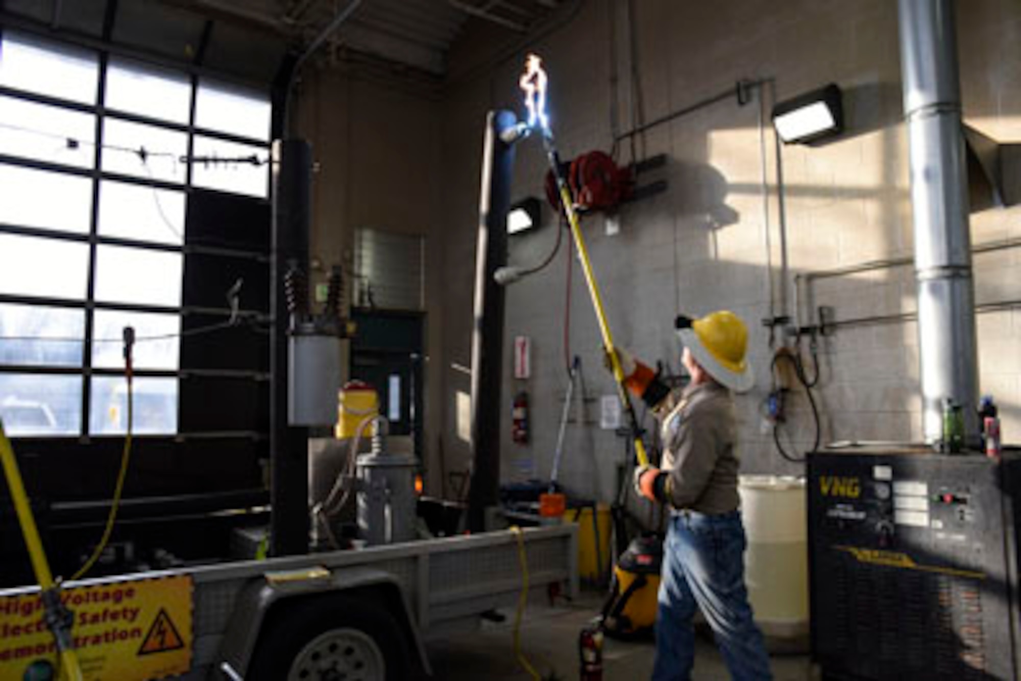 A volunteer from the Arkansas Baptist State Convention Disaster Relief organization
demonstrates the power of exposed or fallen power lines during the state active active duty training Dec. 20, 2016, at Little Rock Air Force Base, Ark. Airmen must learn how to handle any emergency situation that might arise due to weather. (U.S. Air National Guard photo by Tech. Sgt. Jessica Condit)