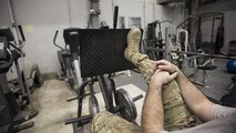 Tech. Sgt. Jason Caswell, 455th Expeditionary Aircraft Maintenance Squadron C-130 Hercules debrief NCO-in-charge, rests while doing single-leg presses to strengthen his amputated leg Jan. 4, 2016 at Bagram Airfield, Afghanistan. After a sports injury in 2010, Caswell underwent a year of surgeries, two years of painful limb-recovery therapy, followed by physical therapy. In October 2014, his limb still hadn’t healed and began to worsen. Caswell elected to amputate the injured leg. (U.S. Air Force photo by Staff Sgt. Katherine Spessa)