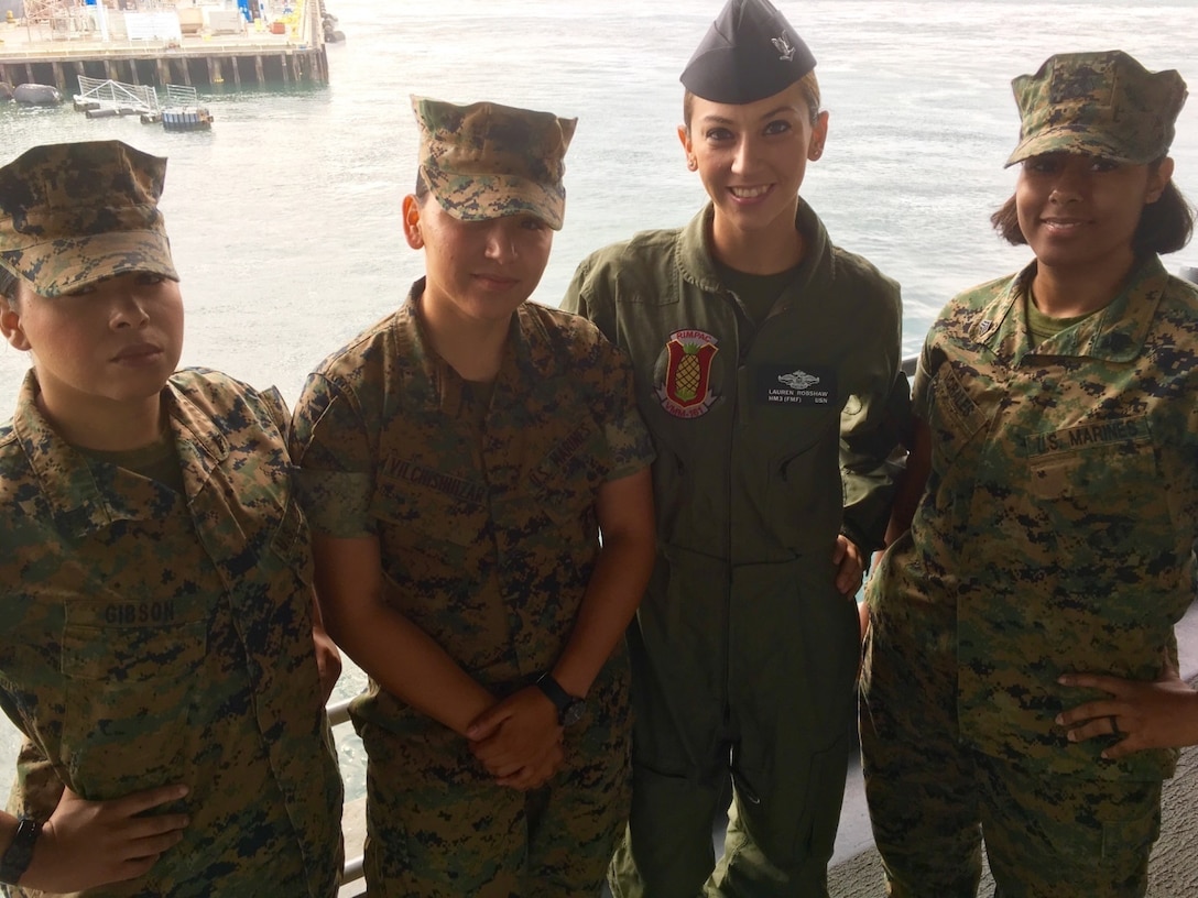 From left, Marine Corps Cpl. Brittney Gibson, Marine Corps Lance Cpl. Marisol Vilchismuizar, Navy Petty Officer 3rd Class Lauren Robshaw and Marine Corps Sgt. Thamya Morales pose for a photo in San Diego before going underway for Exercise Rim of the Pacific 2016, July 19, 2016. During RIMPAC, Morales was responsible for embarking gear and supplies for Marine Medium Tiltrotor Squadron 161. Courtesy photo