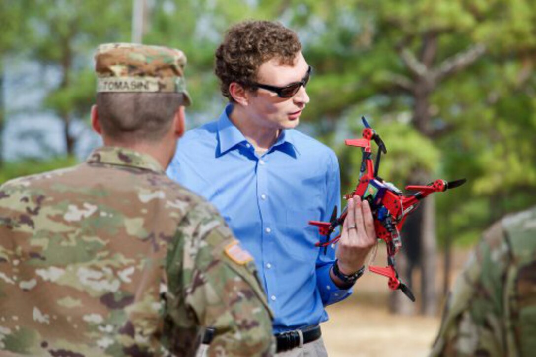 John Gerdes, an engineer with the U.S. Army Research Laboratory, explains the capabilities of the On-Demand Small Unmanned Aircraft System, or ODSUAS, to soldiers at the Army Expeditionary Warrior Experiments at Fort Benning, Ga., Dec. 1, 2016. Army photo by Angie DePuydt