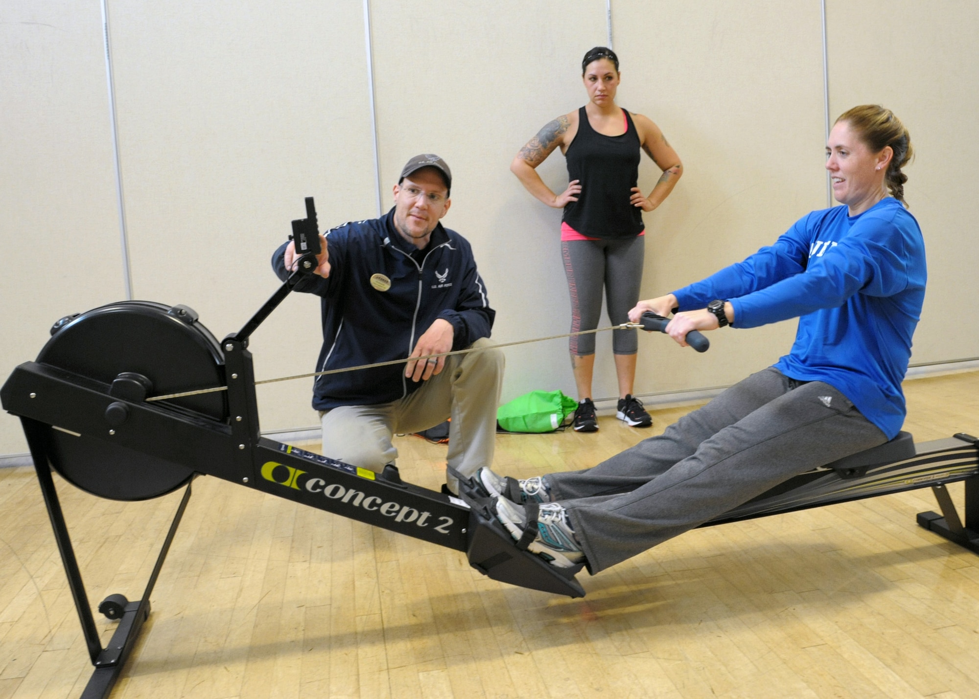 Christian Wasylchak, fitness program manager, assists 2nd Lt. Rebecca, 558 Flying Training Squadron remote piloted aircraft student, on the rowing machine at the Rambler Fitness Center at Joint Base San Antonio-Randolph, Dec. 6, 2016. There are 11 fitness centers throughout JBSA providing strength and conditioning equipment from weights to cardio and classes from aerobics to Taekwondo. The fitness centers are free to Department of Defense cardholders, including active-duty, Reserve and National Guard members, military family members, military retirees and government civilians.