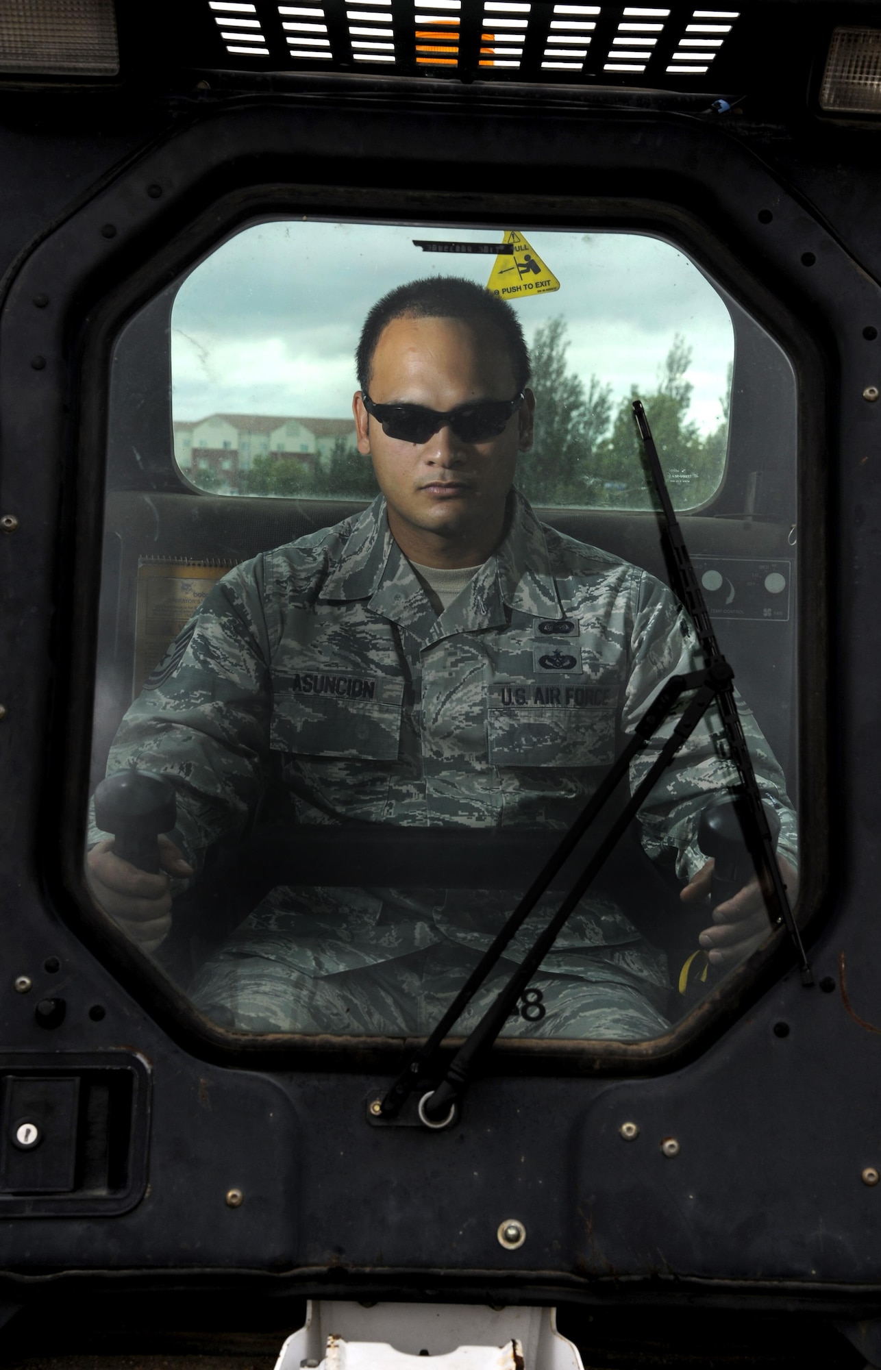 Tech. Sgt. Michael Asuncion Jr., formerly assigned to the 45th Civil Engineer Squadron at Patrick Air Force Base, Florida, sits in a Bobcat skid steer at Minot Air Force Base, N.D., July 12, 2016. Asuncion was named one of the 12 Outstanding Airmen of the Year for 2015 when he was a “dirt boy” at Patrick AFB, Fla. (U.S. Air Force photo/Airman 1st Class Christian Sullivan) 