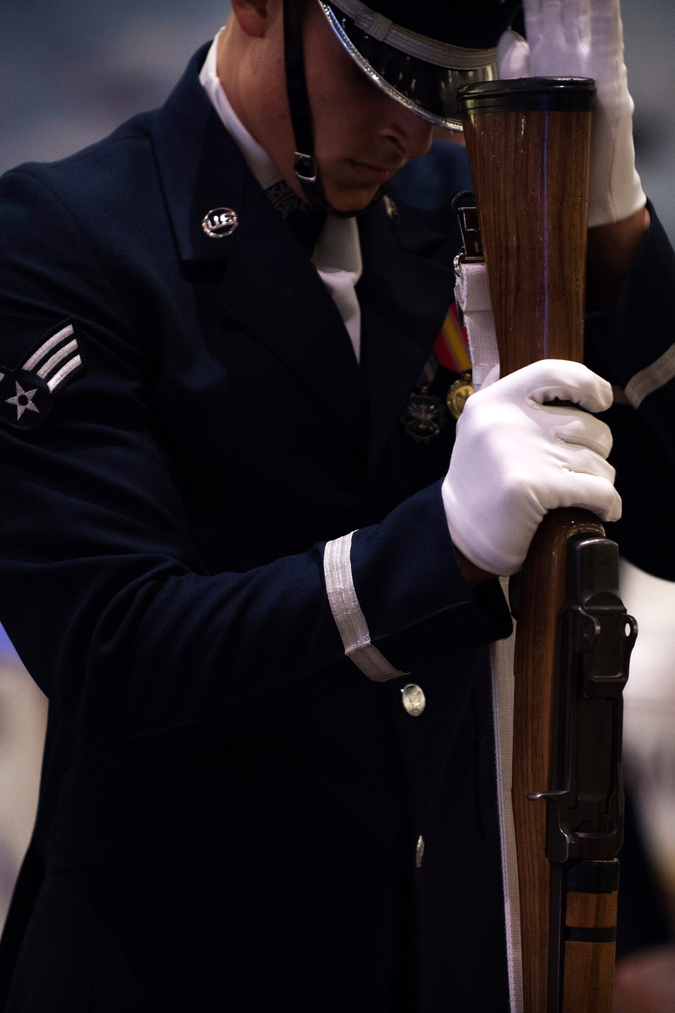 Senior Airman Angelo Hightower, U.S. Air Force Honor Guard Drill Team member, performs a rifle maneuver at the Live on Green event in Pasadena, Calif., Dec. 31, 2016. The Live on Green event is held annually as a celebration leading up to the Rose Parade and Rose Bowl Game. (U.S. Air Force photo by Senior Airman Philip Bryant)