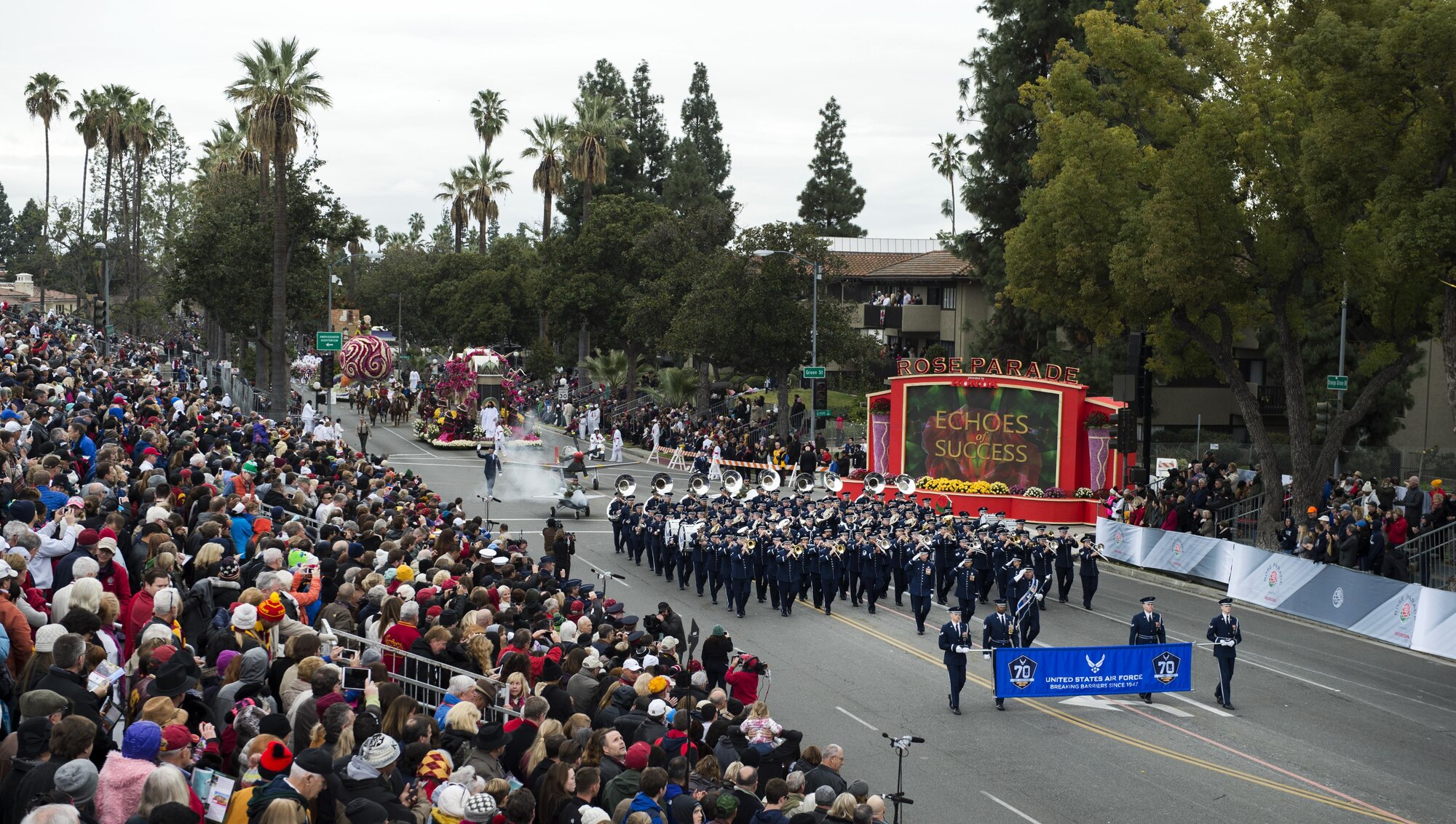 U.S. Air Force Honor Guard Drill Team members and the Air Force Total Force Band march in the 128th Rose Parade in Pasadena, Calif., Jan. 2, 2017. The Honor Guard and Total Force Band represented the Air Force in front of approximately one million spectators to kick off a year-long celebration of the Air Force’s 70th Birthday. (U.S. Air Force photo by Senior Airman Philip Bryant)