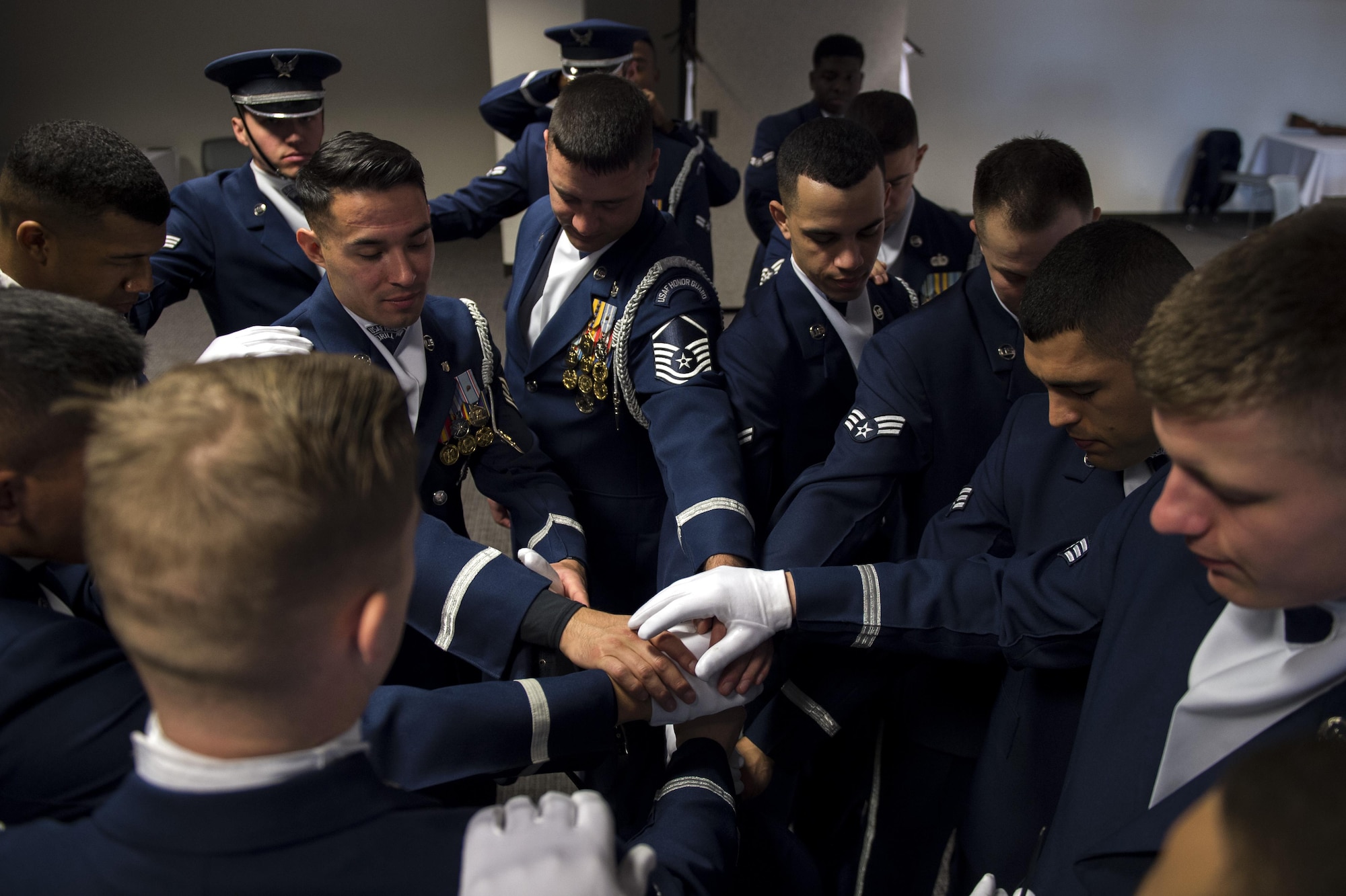 U.S. Air Force Honor Guard Drill Team members pray before a performance at the Live on Green event in Pasadena, Calif., Jan. 1, 2017.Drill team members come together and pray as part of their pre-drill ritual before every performance. (U.S. Air Force photo by Senior Airman Philip Bryant)