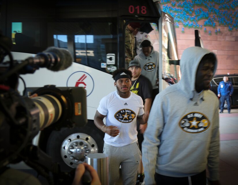 A group of High-school athletes from the U.S. Army All-American Bowl east and west teams step off a bus in front of the University Hospital in San Antonio before visiting sick and injured children as part of a community relations event.  The athletes and their Soldier mentors are in town preparing for the All-American Bowl game on Jan. 7.  For 16 years the Bowl has been the nation's premier high school football game, serving as the preeminent launching pad for America's future college and National Football League stars. (Photo by U.S. Army Reserve Sgt. 1st Class Brent C. Powell)