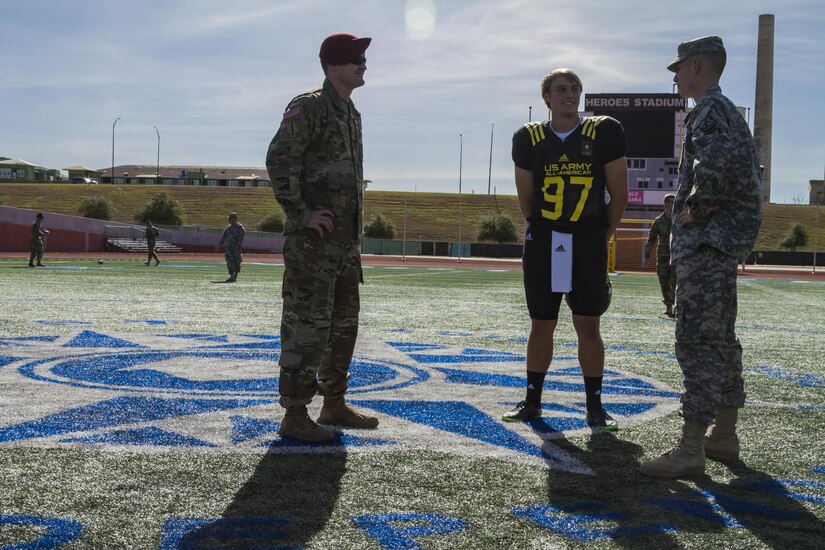 Soldier mentors Staff Sgt. Aaron Ravenscroft (left), 160th Special Operations Aviation Regiment (Airborne), and Cadet of the year Cadet John L. Phillips (right), Virginia Military Institute, speak with Joseph Bulovas about his plans after high school during a break in the joint Army All-American Bowl East/West practice Jan. 3, at Heroes Stadium in San Antonio.  Soldier mentors are selected because they have excelled in their personal and professional endeavors, are paired with AAB participants to share their personal stories of perseverance, selfless-service and excellence with the All-Americans. The practice was held in preparation for the 2017 U.S. Army All-American Bowl, which will kick off Jan. 7, at the San Antonio Alamodome, and will be broadcast live on NBC at 12 p.m. CST. The U.S. Army All-American Bowl is the nation's premier high school football game and it provides a platform for Soldiers to engage with students, families and community officials while showcasing the Army’s latest innovations in technology and its ongoing commitment to the development of America’s future leaders. (U.S. Army Reserve photo by Spc. James Lefty Larimer, 367th Mobile Public Affairs Detachment)