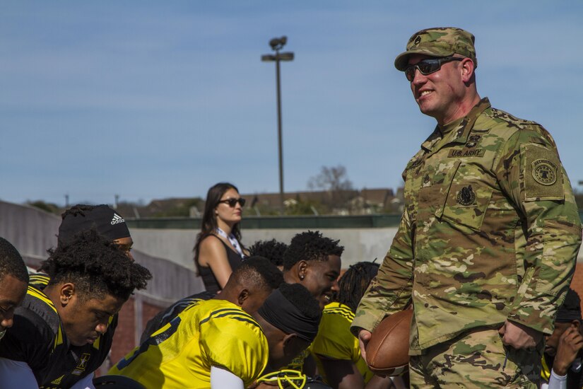 Staff Sgt. Justin Arrant, a recruiter with the Mid-Atlantic Recruiting Battalion at Cherry Hill Recruiting Station, Cherry Hill, New Jersey, speaks with U.S. Army All-American Bowl players during the joint East/West practice Jan. 3, at Heroes Stadium in San Antonio. Soldier mentors are selected because they have excelled in their personal and professional endeavors, are paired with AAB participants to share their personal stories of perseverance, selfless-service and excellence with the All-Americans. The practice was held in preparation for the 2017 U.S. Army All-American Bowl, which will kick off Jan. 7, at the San Antonio Alamodome, and will be broadcast live on NBC at 12 p.m. CST. The U.S. Army All-American Bowl is the nation's premier high school football game and it provides a platform for Soldiers to engage with students, families and community officials while showcasing the Army’s latest innovations in technology and its ongoing commitment to the development of America’s future leaders. (U.S. Army Reserve photo by Spc. James Lefty Larimer, 367th Mobile Public Affairs Detachment)