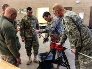 Staff Sgt. Douglas K. Browning instructs soldiers on how to evaluate pipe threading at the 672nd Engineer Company vertical engineer skills competition held Dec. 10 in Missoula, Mont. Pipe threading is a skill that is required by 12K (plumber) and 12R (indoor electrician) military occupational specialties. The vertical engineer skills competition was held to inspire the same enthusiasm for vertical engineers that is held in other areas of the Corps of Engineers, and to show off Army Reserve life to members of the community (U.S. Army Reserve Photo by Sgt. 1st Class Leroy E. Bierfreund/Released).