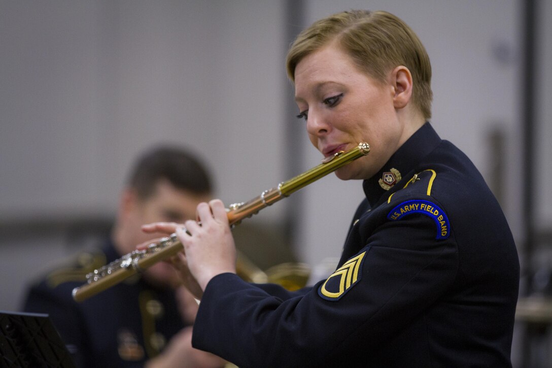 SAN ANTONIO, TX (January 3, 2017) - SSG Pam Daniels, a flautist in the U.S. Army Field Band,
performs selections from Grand Polonaise, by Theorore Bohm, to the 2017 U.S. Army All-American Marching Band. Members of the band are the nation's top high school senior band and color guard members that will perform the halftime show at the Alamodome on Saturday, January 7, 2017)

(U.S. Army Photo by Cpl. Timothy Yao/ Released)