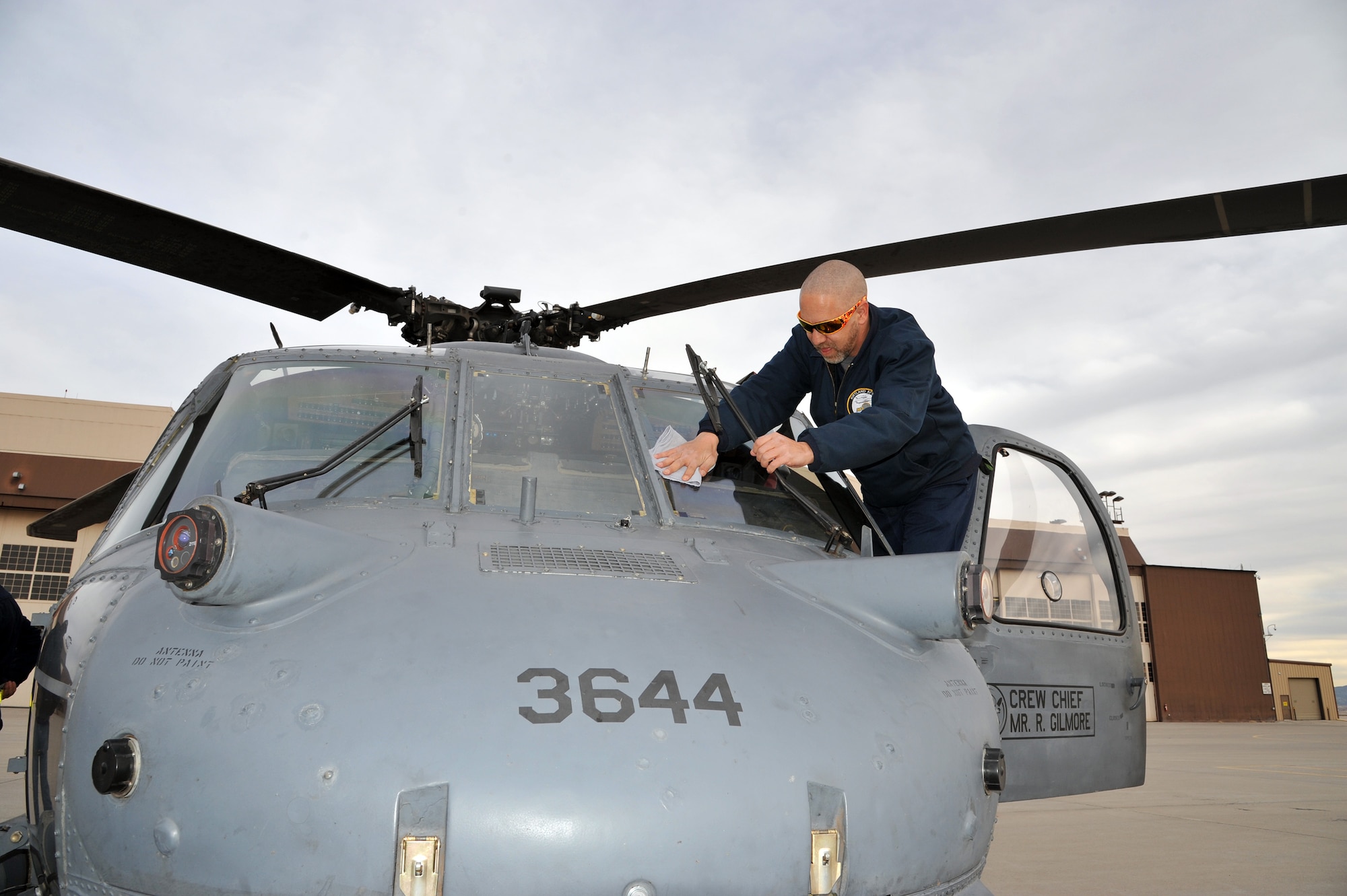 Bob Gilmore, M1 Support Services crew chief, prepares his aircraft for a training mission, where it will surpass 12,000 flying hours.