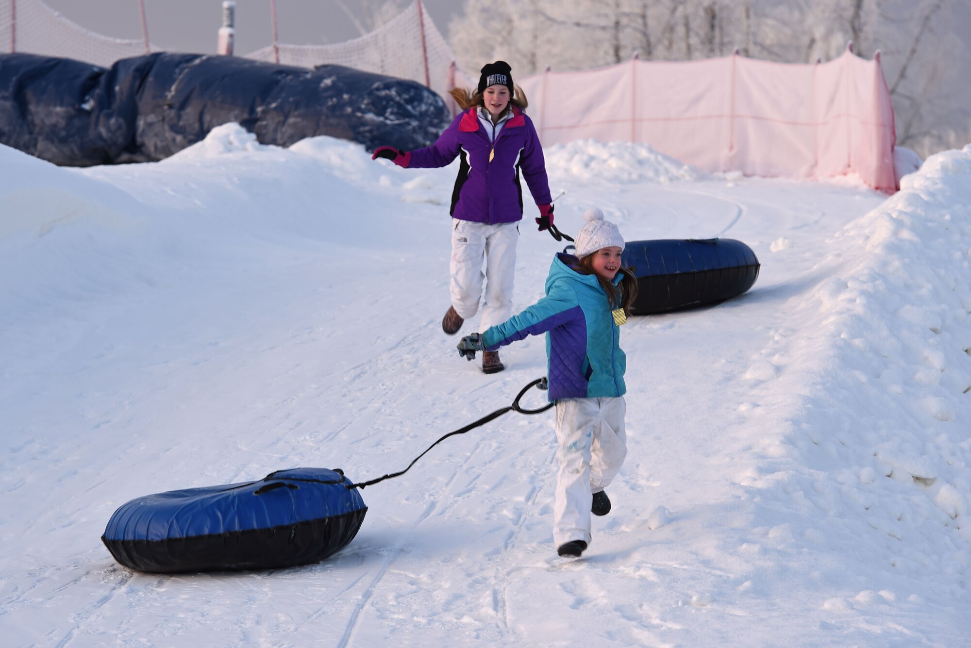 Joint Base Elmendorf-Richardson service members and families participate in Winterfest at the Hillberg Ski Area, Dec. 22, 2016.The event featured face painting, gingerbread house making, pictures with Santa, snow machine riding, dog sled riding, tubing, skiing and snowboarding. 