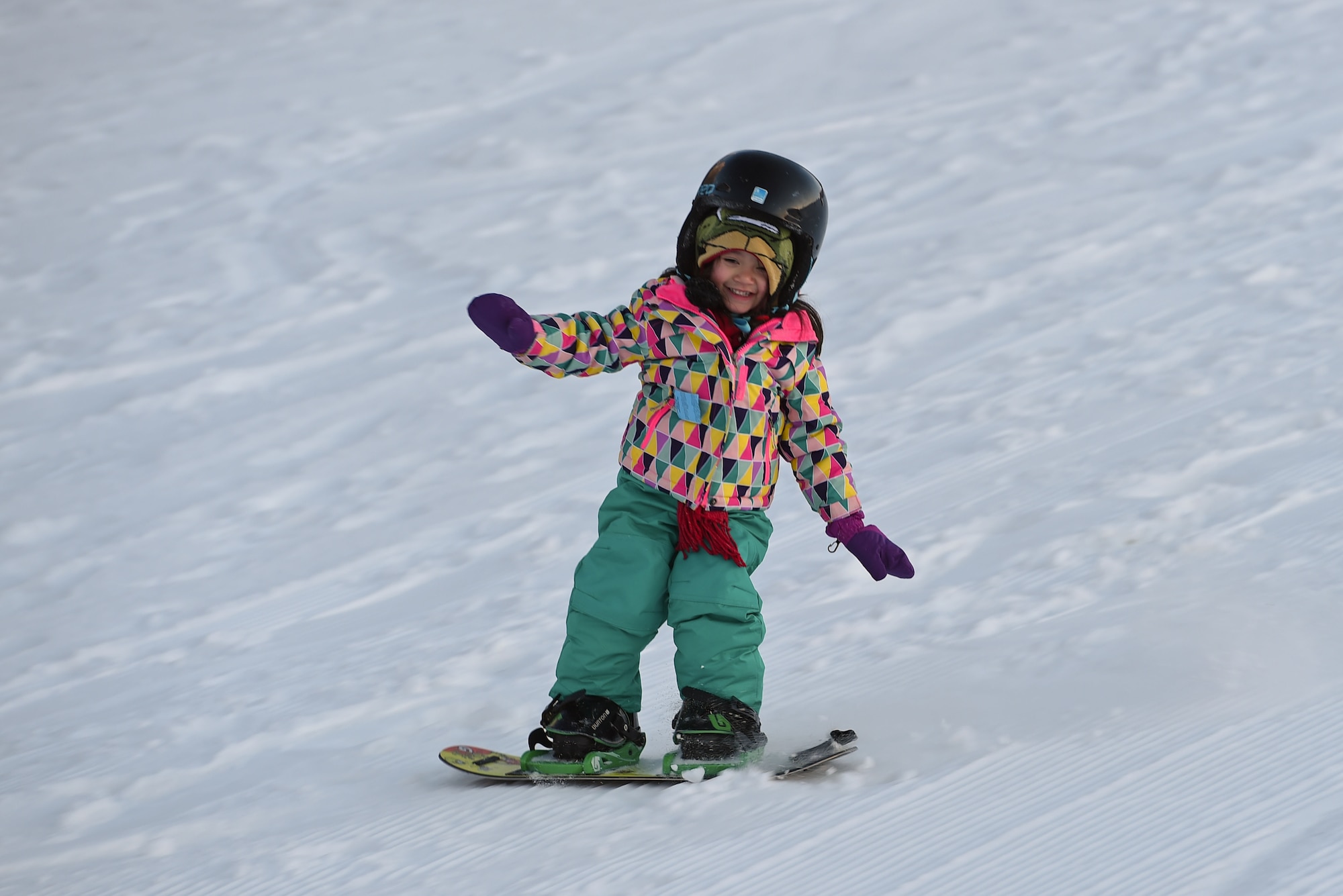 Joint Base Elmendorf-Richardson service members and families participate in Winterfest at the Hillberg Ski Area, Dec. 22, 2016.The event featured face painting, gingerbread house making, pictures with Santa, snow machine riding, dog sled riding, tubing, skiing and snowboarding. 