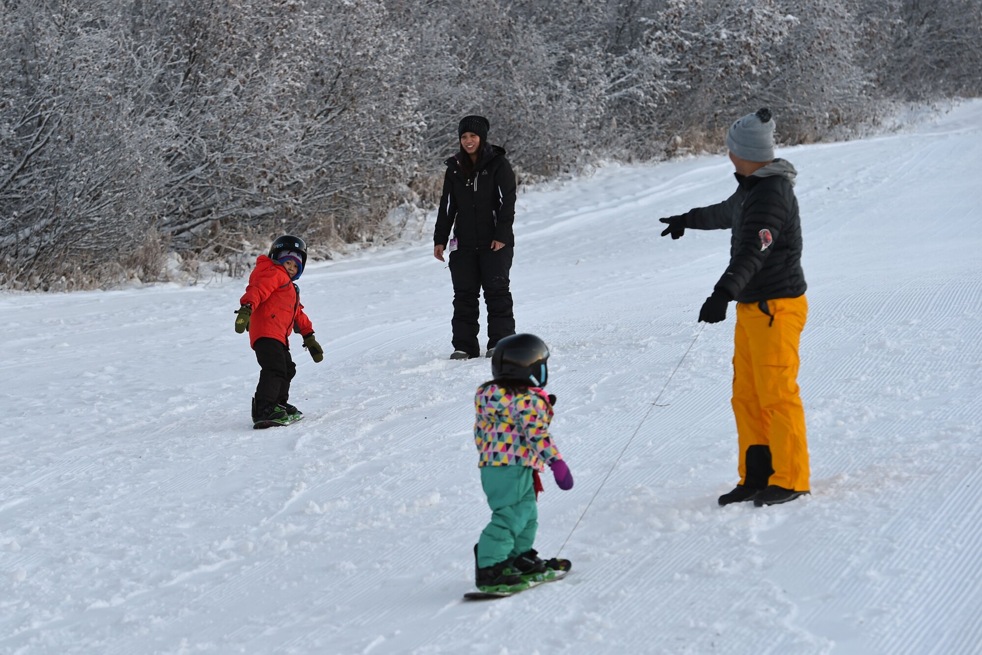 Joint Base Elmendorf-Richardson service members and families participate in Winterfest at the Hillberg Ski Area, Dec. 22, 2016.The event featured face painting, gingerbread house making, pictures with Santa, snow machine riding, dog sled riding, tubing, skiing and snowboarding. 
