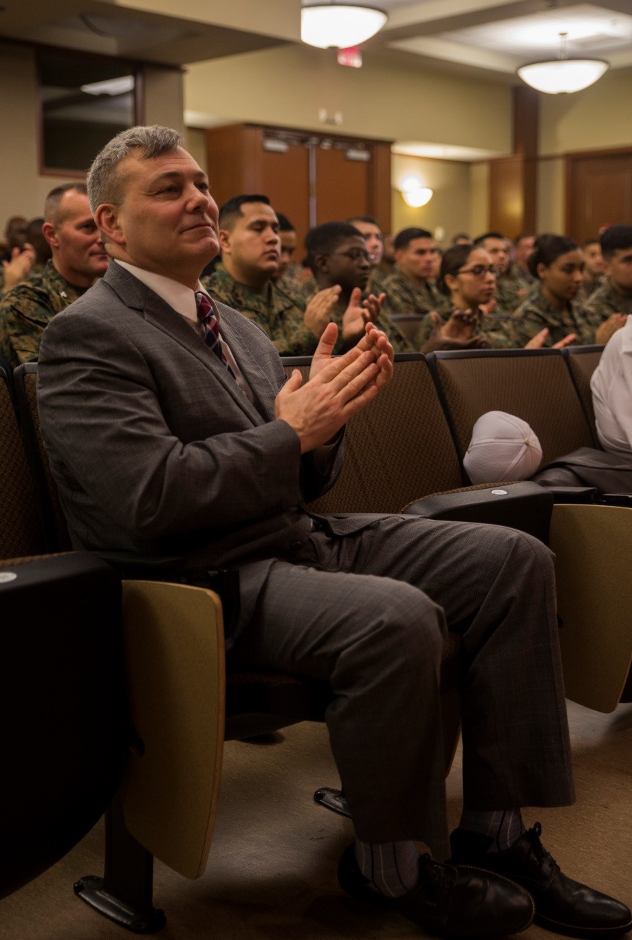 Gregg T. Habel, executive director of Marine Forces Reserve and Marine Forces North, applauds the 2016 Civilian of the Year award recipients at Marine Corps Support Facility New Orleans, Jan. 4, 2017. The recipients for the junior and senior Civilian of the Year award were nominated by their leadership for excelling in the workplace and for continuously going above and beyond in their everyday job duties. (U.S. Marine Corps photo by Cpl. Melissa Martens/ Released) 