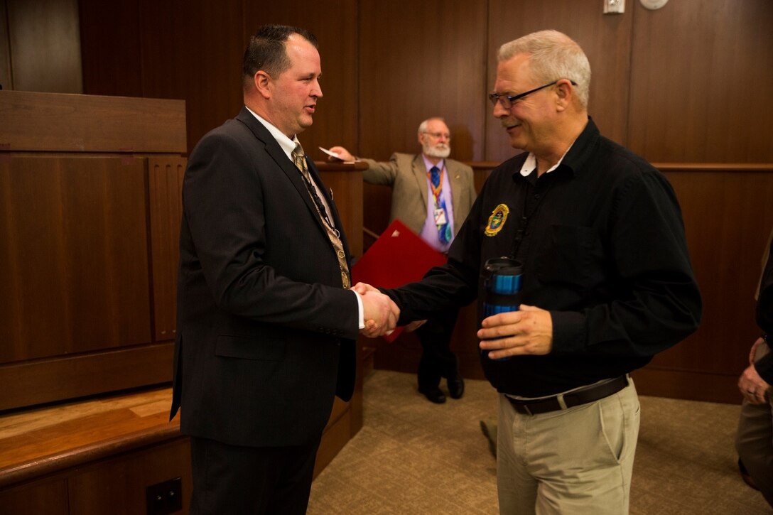 Todd Lemoine, director of mission assurance for Marine Forces Reserve, is congratulated by his colleagues after receiving the 2016 Senior Civilian of the Year award at Marine Corps Support Facility New Orleans, Jan. 4, 2017. Lemoine was recognized for the critical role he played throughout the year at MARFORRES in achieving mission accomplishment. (U.S. Marine Corps photo by Cpl. Melissa Martens/ Released)