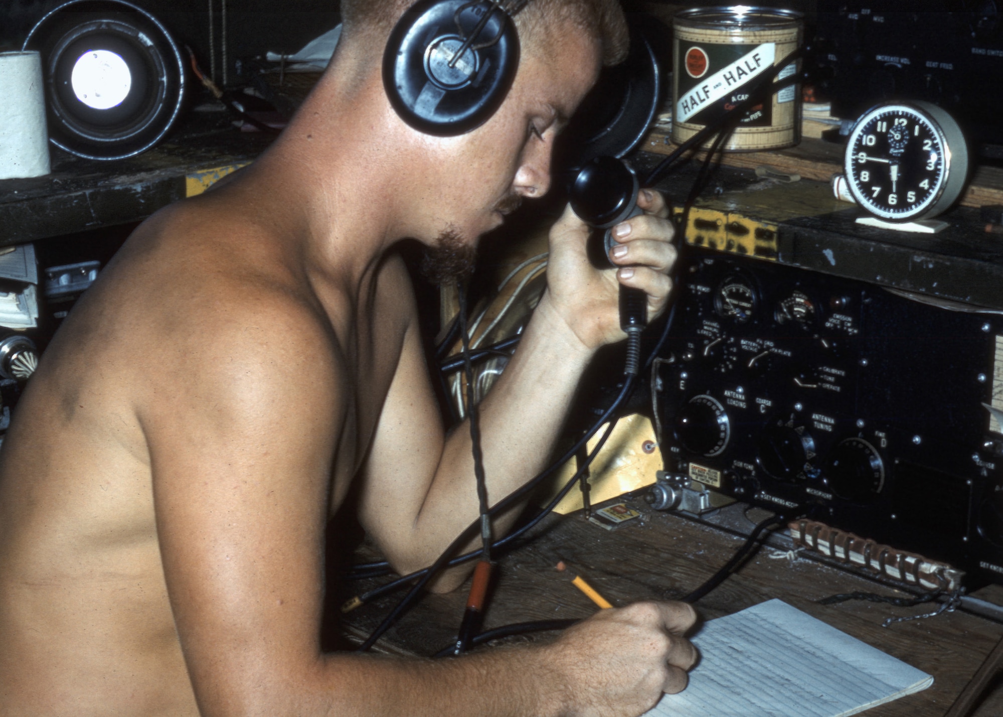 Airman 2nd Class Bob Cunningham, 1374th Mapping and Charting Squadron, operates radar equipment on North Danger Island in 1956. The tiny island in the South China Sea, located midway between the Philippine Islands and Vietnam, became an important station during an Air Force project to accurately map the world using aerial electronic geodetic survey. The processed data would eventually benefit intercontinental ballistic missile targeting. (Courtesy photo/Bob Cunningham)