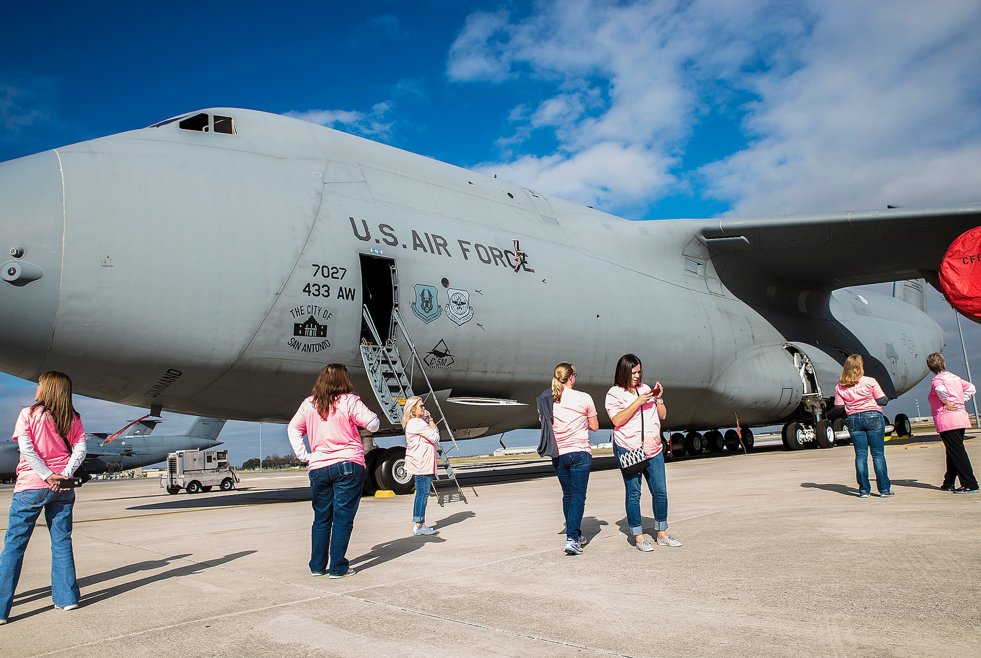 Air Force Wing Moms tour a C-5M Super Galaxy aircraft  Jan. 5, 2017 at Joint Base San Antonio-Lackland, Texas. The AFWM's mission is to provide support to family members and friends of trainees who are  experiencing Air Force Basic Military Training. (U.S. Air Force photo by Benjamin Faske)