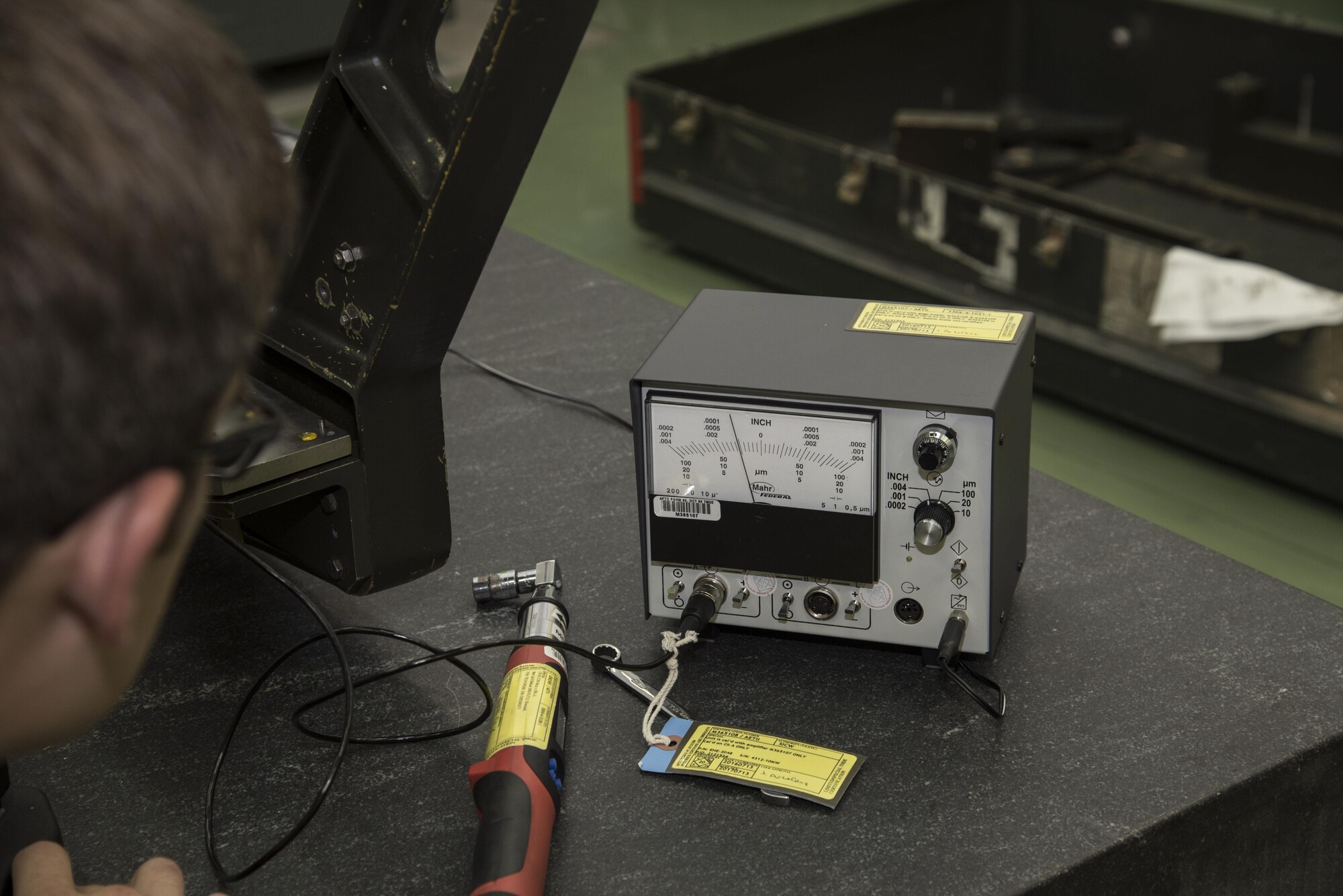 U.S. Air Force Staff Sgt. Jeffery Tyler, a 35th Maintenance Group physical dimension NCO in charge, reads an electronic height gage at Misawa Air Base, Japan, Nov. 2, 2016. The height gage is used to measure how parallel an object is to a flat surface and can measure as small as .0001 of an inch. (U.S. Air Force photo by Airman 1st Class Sadie Colbert)