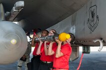 U.S. Air Force Airmen from the 67th Aircraft Maintenance Unit load an AIM-9X Sidewinder missile onto an F-15 Eagle Jan. 4, 2017, at Kadena Air Base, Japan. During the annual weapons load competition, crews are given 60 minutes to load eight missiles onto an F-15 Eagle. (U.S. Air Force photo by Senior Airman Lynette M. Rolen/Released)