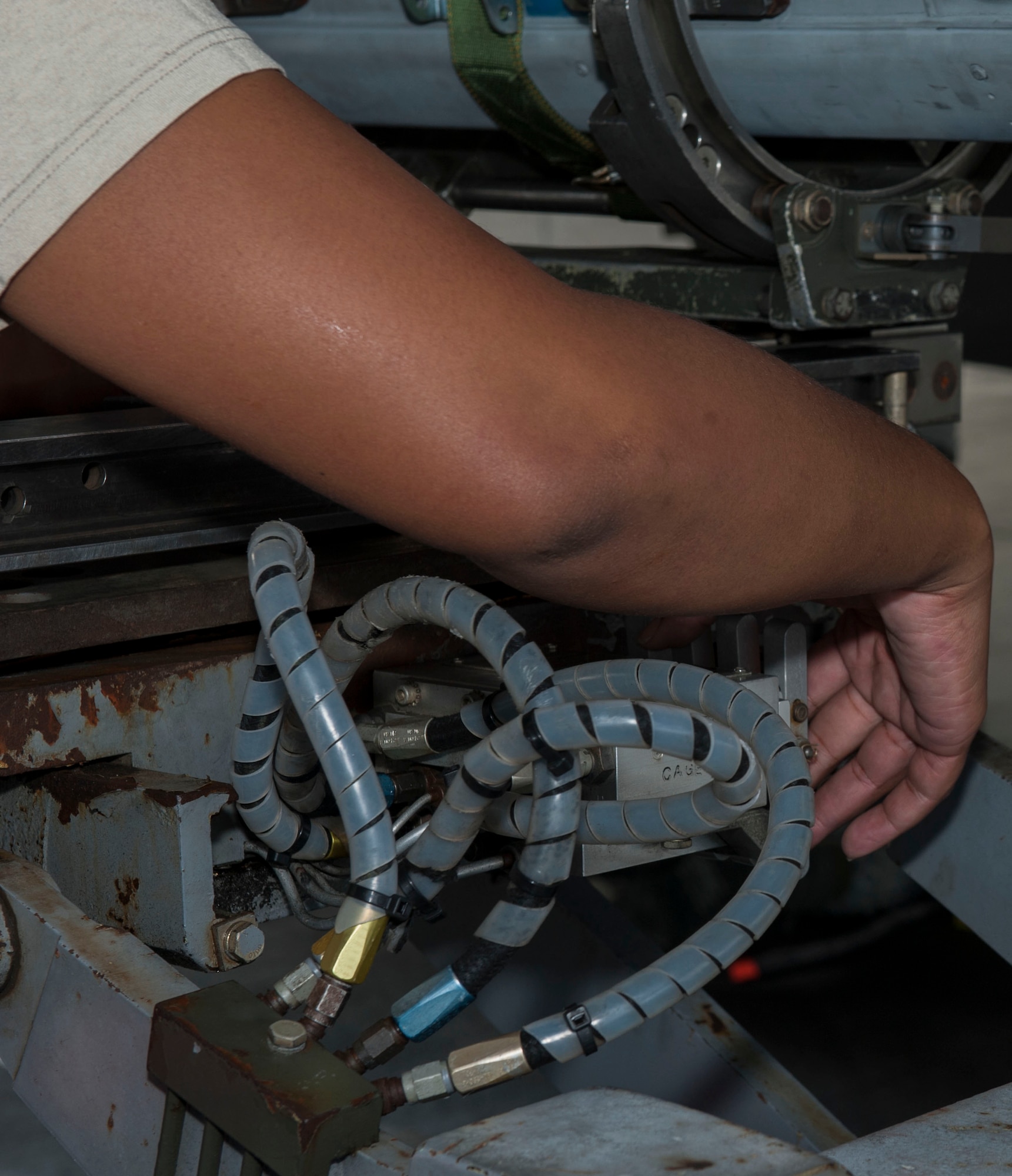 U.S. Air Force Staff Sgt. Niquita Newton, 67th Aircraft Maintenance Unit weapons load crew chief, moves an AIM-120 Advanced Medium Range Air-to-Air Missile onto an F-15 Eagle Jan. 4, 2017, at Kadena Air Base, Japan. The AIM-120 AMRAAM is capable of a multitude of operations, with capabilities of reaching mach four, radar homing and explosive warheads. (U.S. Air Force photo by Senior Airman Lynette M. Rolen/Released)