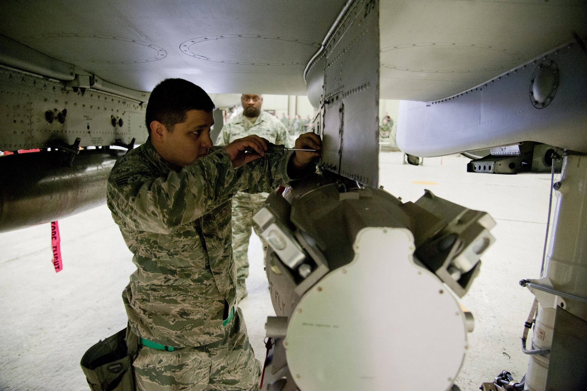 U.S. Air Force Senior Airman Anthony Cingolan, 25th Aircraft Maintenance Unit weapons load crewmember, tightens screws on a CBU-103 that is attached to an A-10 Thunderbolt II onto a weapons loader during a weapons load competition on Osan Air Base, Republic of Korea, Jan. 6, 2017. The best weapons load crew from the 25th and 36th AMUs battle it out every quarter to see which unit can reload munitions on their respective aircraft the quickest and safest. (U.S. Air Force photo by Staff Sgt. Jonathan Steffen)
