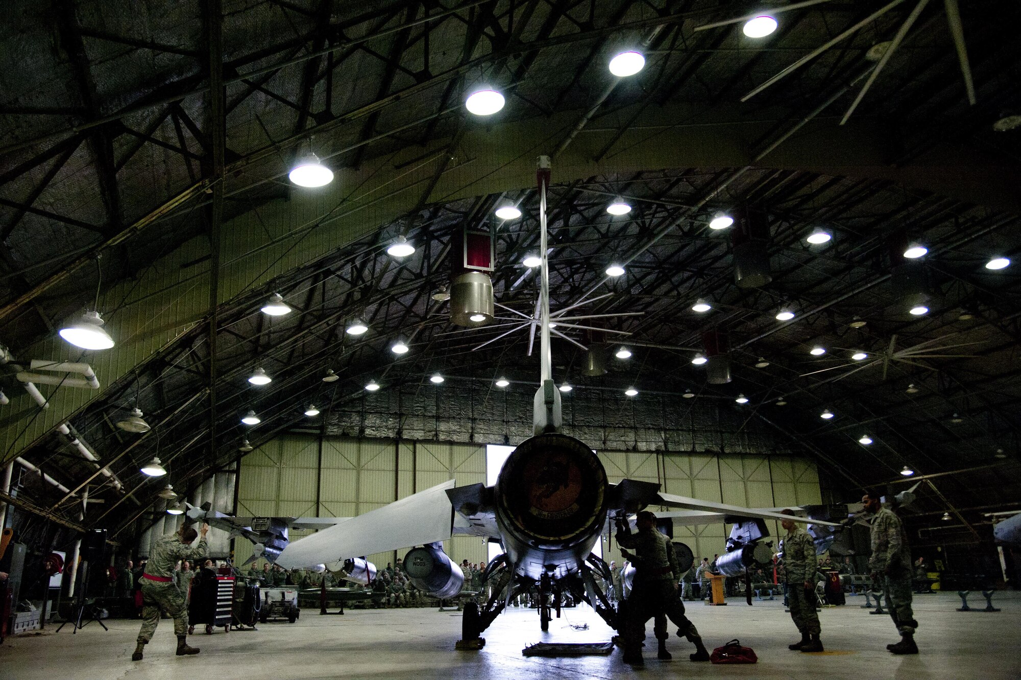 U.S. Air Force 36th Aircraft Maintenance Unit weapons load crew members inspect an F-16 Fighting Falcon during a weapons load competition on Osan Air Base, Republic of Korea, Jan. 6, 2017. The 25th and 36th AMUs loaded two CBU-103 in addition to chaff and flares during the competition. (U.S. Air Force photo by Staff Sgt. Jonathan Steffen)
