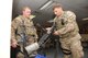Senior Airman Rhea Flambeau, left, and Senior Airman Grayson Bryant, right, 386th Expeditionary Security Forces Squadron patrolmen, check out weapons in the armory at an undisclosed location in Southwest Asia Jan. 1, 2017. Bryant, a member of the wing’s base security zone patrol, is responsible for patrolling the outside of the base to guard against threats posed to the wing mission and interact with citizens who live in the surrounding camps. (U.S. Air Force photo/Tech. Sgt. Kenneth McCann)