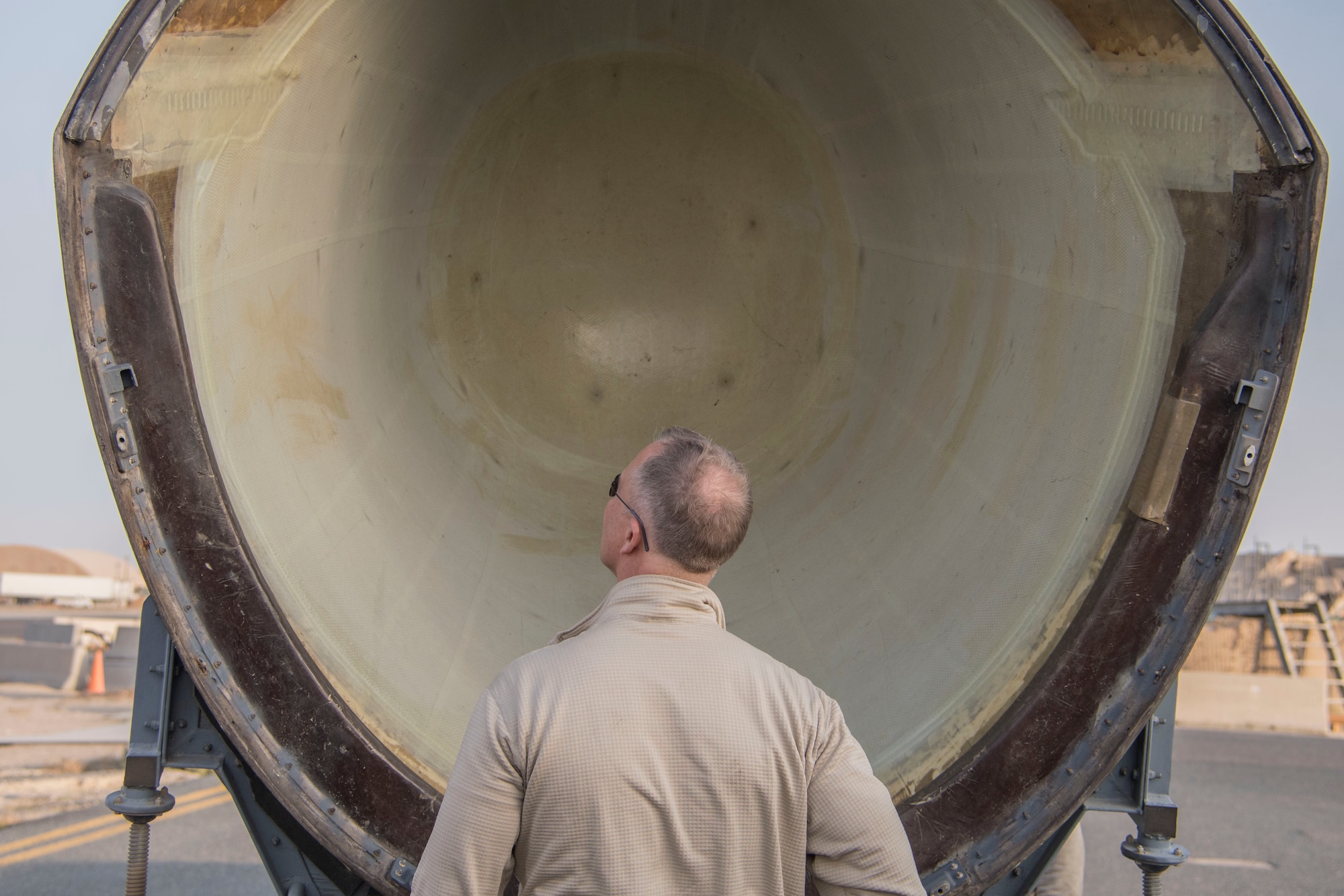 Master Sgt. Luke Grigsby, 386th Expeditionary Maintenance Squadron aerospace ground equipment craftsman, inspects a radome at an undisclosed location in Southwest Asia Jan. 4, 2017. The squadron received the new radome to replace one on a C-130H Hercules that was struck by lightning. (U.S. Air Force photo/Senior Airman Andrew Park)