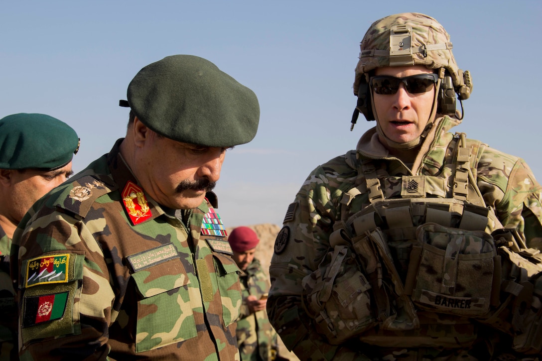 Lt. Gen. Muhammad Waziri, left, 201st Afghan National Army Corps commander, and Train Advise Assist Command-East Command Sgt. Maj. Bryan Barker discuss collective training during an expeditionary advisory package mission in Sarobi district, Afghanistan, Dec. 27, 2016. (U.S. Army photo by Capt. Grace Geiger)