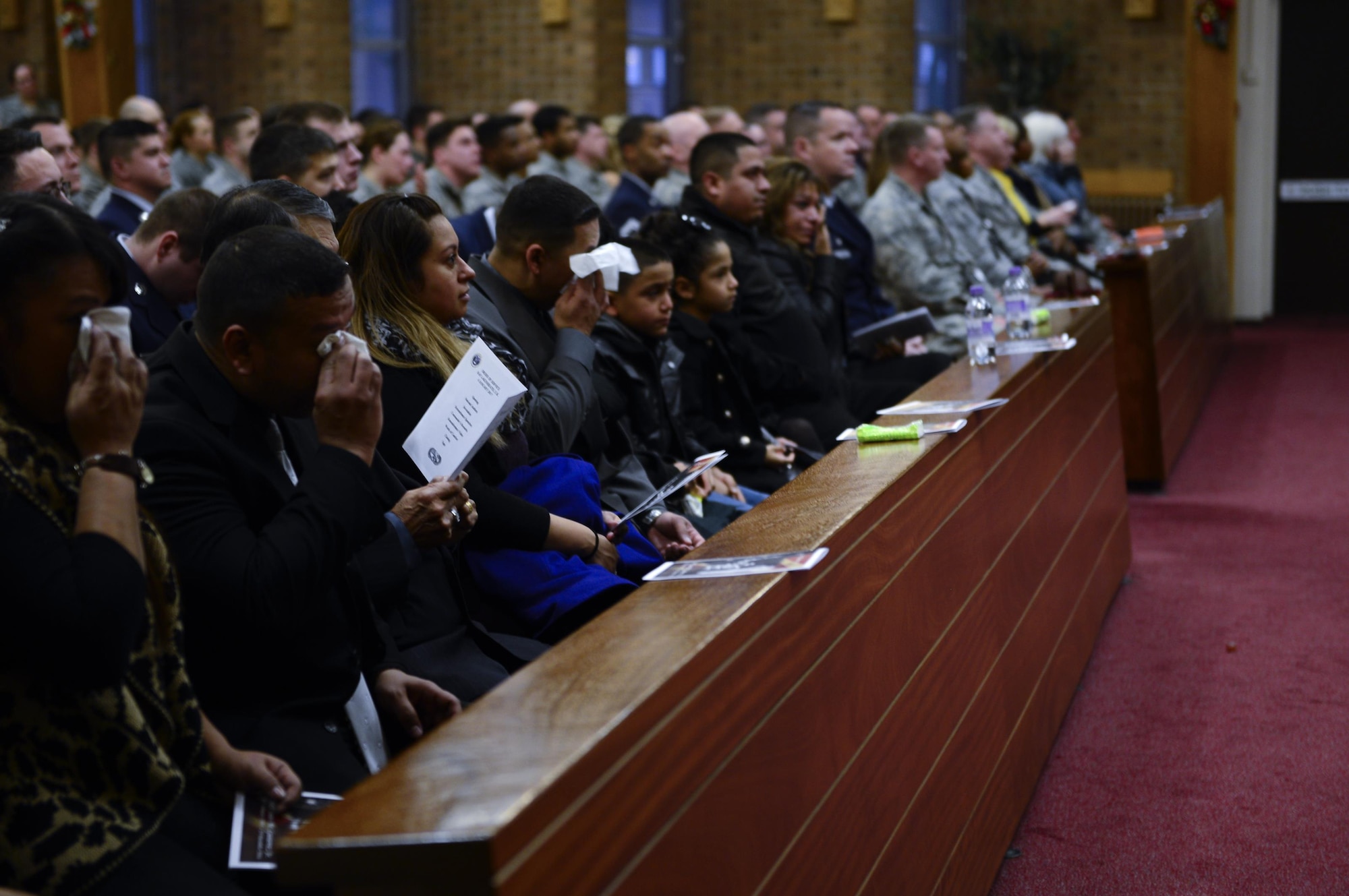 Family and friends mourn the loss of Senior Airman Juan Gutierrez Jr. during a memorial service at the chapel on Royal Air Force Lakenheath. The memorial ended with a rendition of “Taps.”. (U.S. Air Force photo/Senior Airman Malcolm Mayfield)