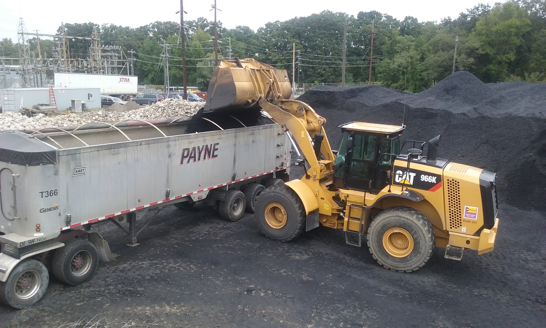 Bituminous coal is removed from a shuttered power plant at U.S. Navy Surface Warfare Center Indian Head in Maryland. The DLA Disposition Services assistance in finding a new home for the coal saved an estimated $6 million in removal costs.