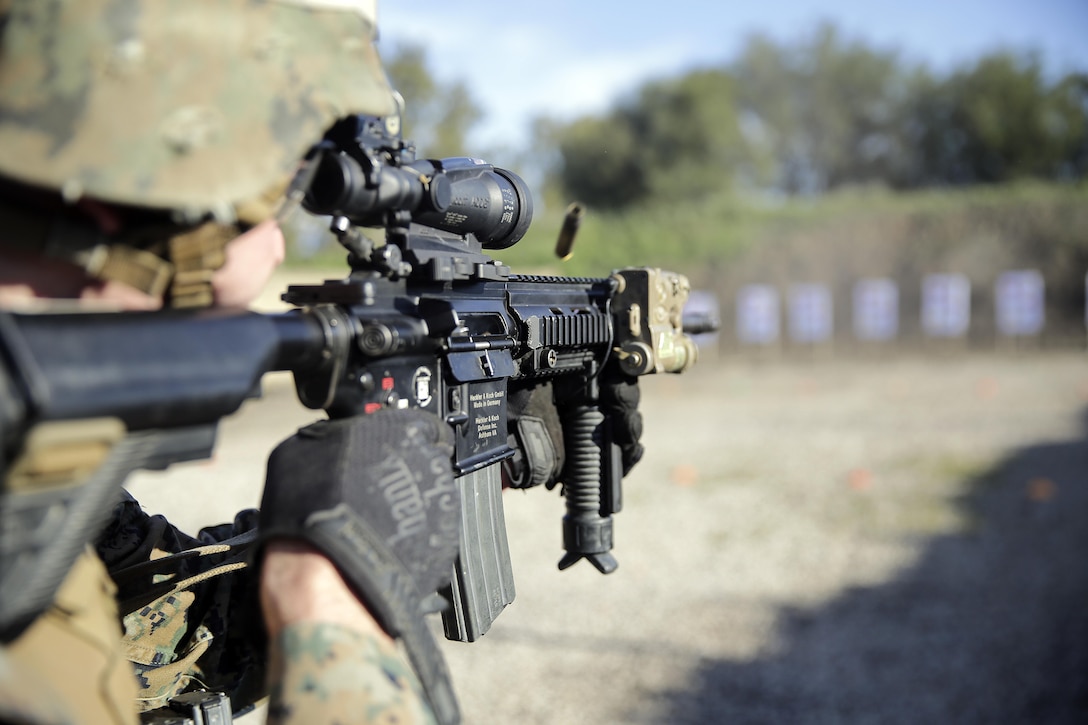Lance Cpl. Phillip August, a rifleman with Special Purpose Marine Air-Ground Task Force Crisis Response-Africa, fires his weapon during a rifle range near Naval Air Station Sigonella, Italy, Jan. 3, 2017. Marines conducted a stress shoot, which involved a physically strenuous work-out followed by a course of fire aimed at testing the Marine's cognitive function. 