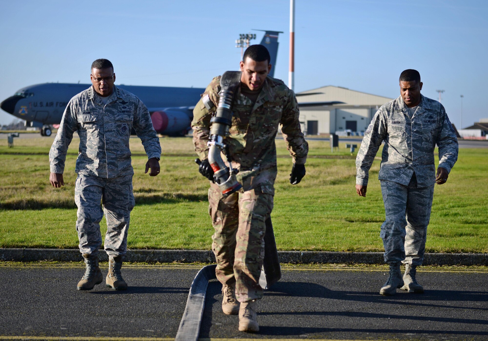 U.S. Air Force Airman 1st Class Sequan Gill, center, 100th Logistics Readiness Squadron fixed facilities operator, demonstrates the forward area refueling point tryout process to U.S. Air Force Lt. Gen. Richard Clark, left, 3rd Air Force commander, and U.S. Air Force Chief Master Sgt. Phillip Easton, 3rd Air Force command chief, Jan. 5, 2016, on RAF Mildenhall, England. There are currently nine Airmen assigned to the FARP team. The team works alongside the 352nd Special Operations Wing to refuel aircraft in austere and potentially dangerous areas. (U.S. Air Force photo by Senior Airman Christine Halan)