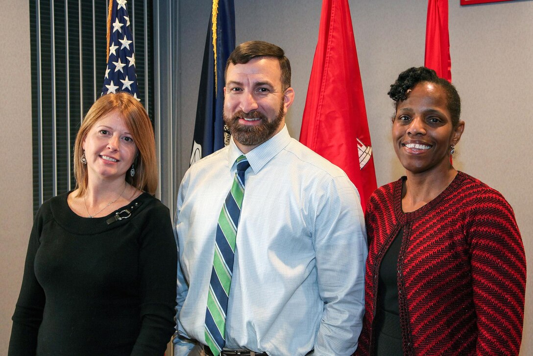 From left, U.S. Army Engineering and Support Center Huntsville employees Tracy Cauffman, Financial Management Analyst, Ross Westbrook, Program Data Analyst and Dee Benson, Chief of Business Practices make up the Enterprise Data Warehouse team ready to help users make a smooth transition to mandatory use of the application.
