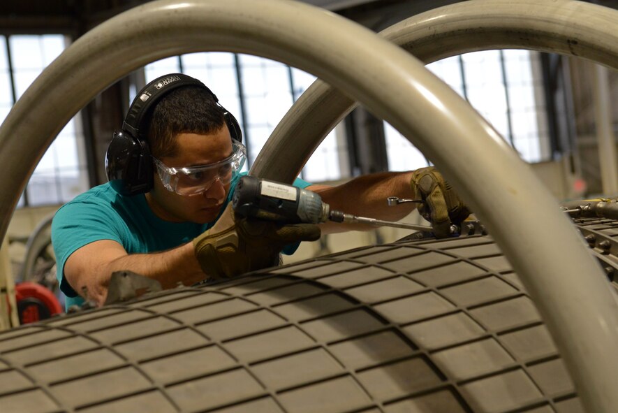 U.S. Air Force Senior Airman Jeffrey Jamshed, 482nd Operations Group Detachment 1 aerospace propulsion journeyman, removes bolts from an aircraft engine at Shaw Air Force Base, S.C., Jan. 6, 2017. The 482nd OG, based out of Homestead Air Reserve Base, Fla., supplies maintainers to various F-16CM Fighting Falcon squadrons such as the 20th Component Maintenance Squadron. The 20th CMS aerospace propulsion flight repairs F-16CM Fighting Falcon engines, keeping 20th Fighter Wing F-16s in flight and ready for the fight. (U.S. Air Force photo by Airman 1st Class Destinee Sweeney)