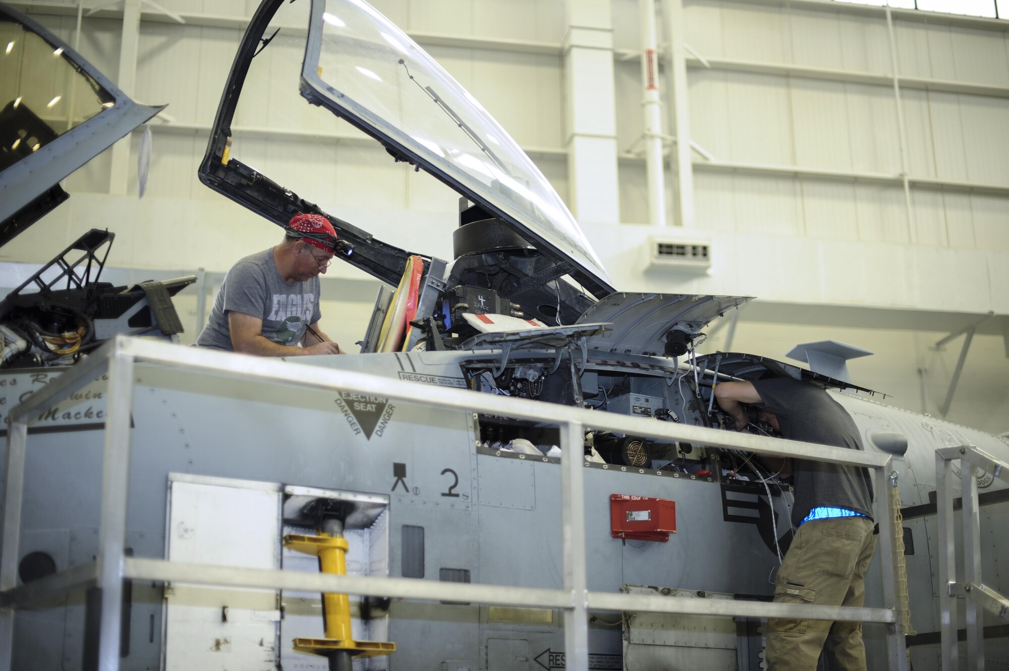 Aircraft technicians from the 309th Aircraft Maintenance and Regeneration Group install a new lightweight airborne recovery system into an A-10C Thunderbolt II at Davis-Monthan Air Force Base, Ariz., Dec. 5, 2016. The LARS V-12 is designed to allow A-10 pilots a more effective means of communication with individuals on the ground such as downed pilots, pararescuemen and joint terminal attack controllers. (U.S. Air Force photo by Airman 1st Class Mya M. Crosby)