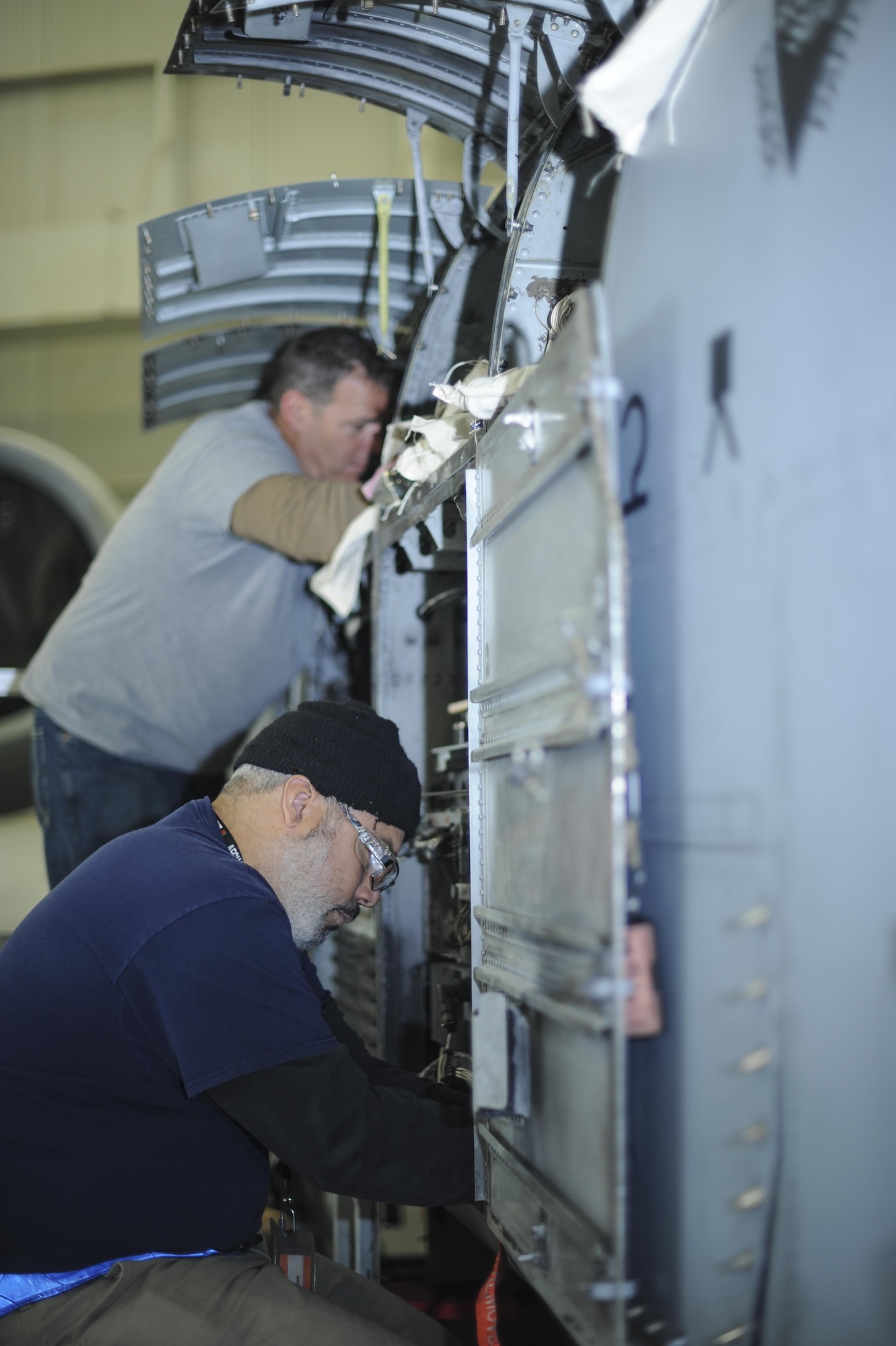 David Antrobus and Fred Massow, 309th Aircraft Maintenance and Regeneration Group aircraft technicians, install a new lightweight airborne recovery system into an A-10C Thunderbolt II at Davis-Monthan Air Force Base, Ariz., Dec. 5, 2016. The 309th AMARG is scheduled to install 142 of Air Combat Command’s aircraft with the new LARS upgrade. (U.S. Air Force photo by Airman 1st Class Mya M. Crosby)