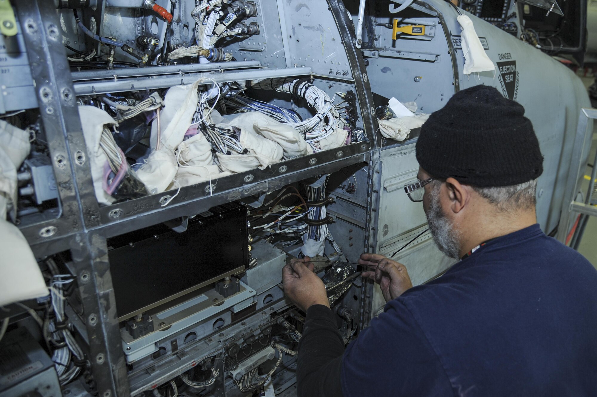 David Antrobus, 309th Aircraft Maintenance and Regeneration Group aircraft technician, installs antenna wires for a lightweight airborne recovery system into an A-10C Thunderbolt II at Davis-Monthan Air Force Base, Ariz., Dec. 5, 2016. The new LARS upgrade provides pilots with GPS coordinates to friendly ground forces and allows them to communicate via voice or text. (U.S. Air Force photo by Airman 1st Class Mya M. Crosby)
