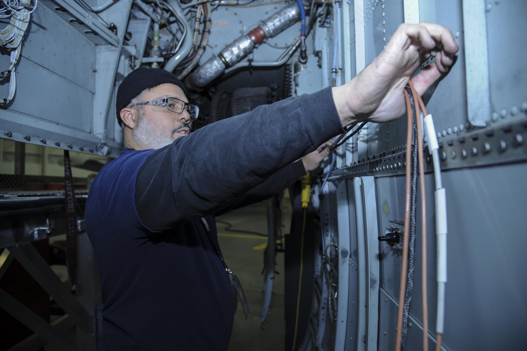 David Antrobus, 309th Aircraft Maintenance and Regeneration Group aircraft technician, installs antenna wires for a lightweight airborne recovery system into an A-10C Thunderbolt II at Davis-Monthan Air Force Base, Ariz., Dec. 5, 2016. The 309th AMARG is scheduled to install the LARS upgrade into 142 of Air Combat Command’s aircraft. (U.S. Air Force photo by Airman 1st Class Mya M. Crosby)