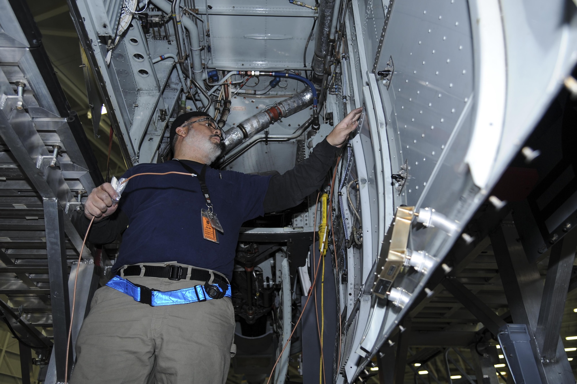 David Antrobus, 309th Aircraft Maintenance and Regeneration Group aircraft technician, installs antenna wires for a lightweight airborne recovery system into an A-10C Thunderbolt II at Davis-Monthan Air Force Base, Ariz., Dec. 5, 2016. The new LARS upgrade provides pilots with GPS coordinates to friendly ground forces and allows them to communicate via voice or text.  (U.S. Air Force photo by Airman 1st Class Mya M. Crosby)