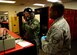 Maj. Matt Hellier (left), 1st Reconnaissance Squadron student pilot receives an equipment check from Staff Sgt. Matthew Young, 9th Operational Support Squadron noncommissioned officer in charge of aircrew flight equipment Jan. 5, 2016, at Beale Air Force Base, California. Aircrew flight equipment is responsible for all of a pilot’s gear such as helmet, oxygen mask, harness and all life-saving devices. (U.S. Air Force photo/Staff Sgt. Jeffrey Schultze)