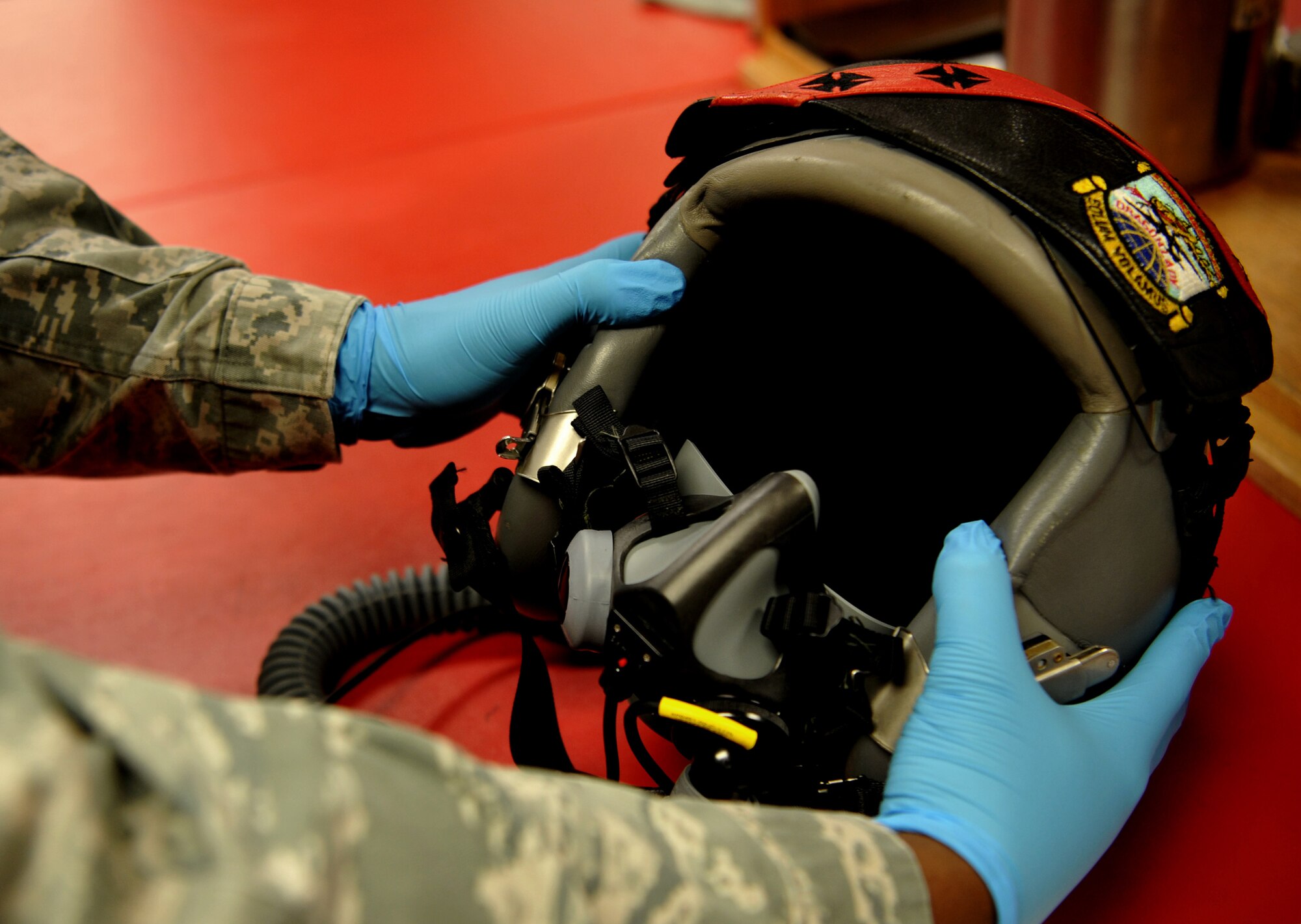 Staff Sgt. Matthew Young, 9th Operational Support Squadron noncommissioned officer in charge of aircrew flight equipment performs an equipment check on a pilot helmet Jan. 5, 2016, at Beale Air Force Base, California. Aircrew flight equipment personnel manage the inspection, maintenance and adjustments to the devices assigned to the pilots they support. (U.S. Air Force photo/Staff Sgt. Jeffrey Schultze)