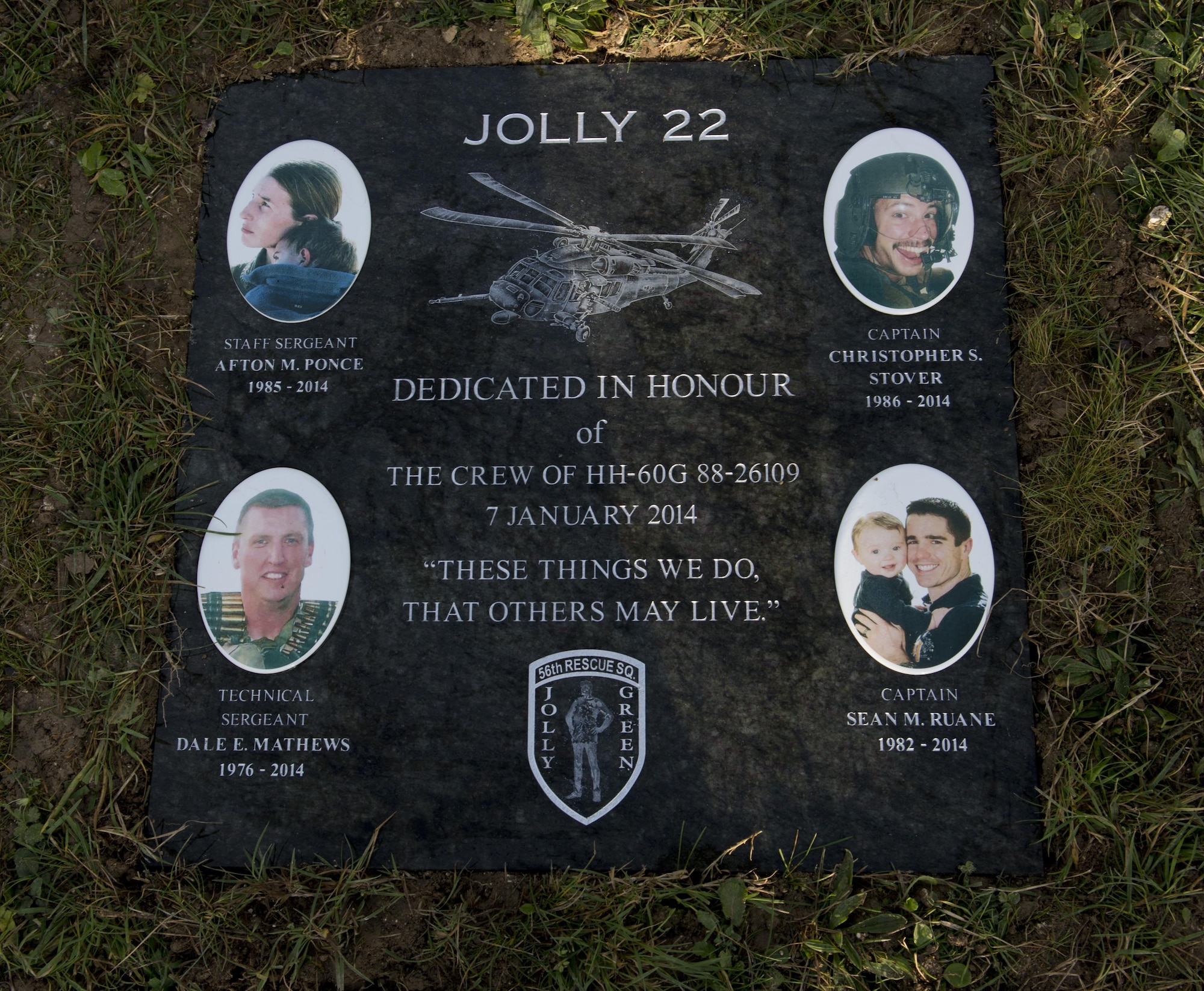 A memorial stone is unveiled during a dedication at the Norfolk Wildlife Trust in Cley-Next-the Sea Jan. 6, 2017. The stone was dedicated to the four Airmen who made the ultimate sacrifice when their HH-60G helicopter crashed on Jan. 7, 2014. (U.S. Air Force photo/Staff Sgt. Stephanie Longoria)