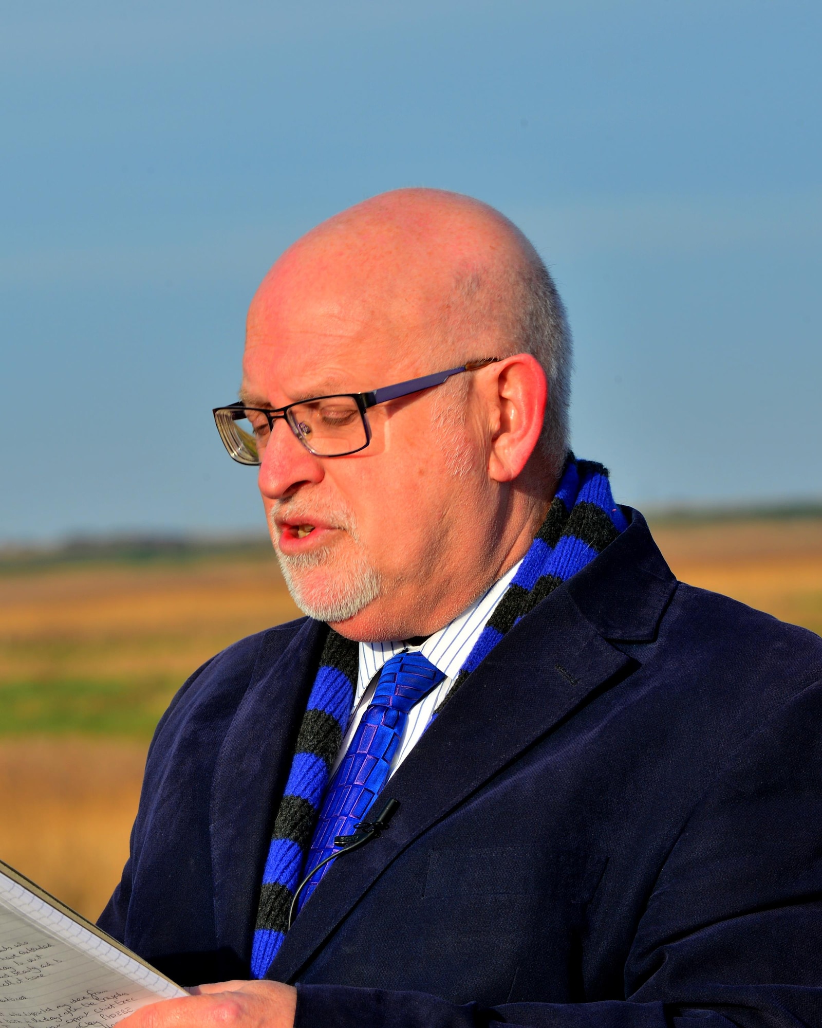 Nigel Pickover, Archant Editor Emeritus and organizer of the memorial dedication, speaks to a gathering of family, friends, U.S. Airmen and U.K. community members during the Jolly 22 memorial dedication, Jan. 6, 2017. A memorial stone was dedicated to the four Airmen who made the ultimate sacrifice during a low-flying training mission on Jan. 7, 2014. (U.S. Air Force photo/Staff Sgt. Stephanie Longoria)