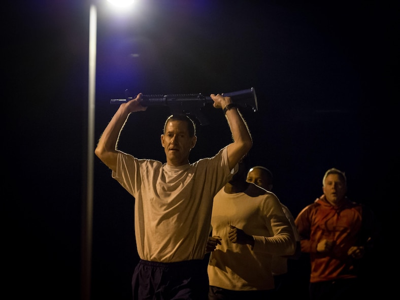 Lt. Col. John Robinson, 315th Airlift Wing Operations Group commander, leads a single file relay race during the Warrior Challenge January 5, 2017, at Joint Base Charleston, S.C. The team building event brought together Airmen from various agencies throughout the 315th AW for a friendly competition. Eight teams, averaging four Airmen per team, participated in the challenge. (U.S. Air Force photo by Senior Airman Tom Brading)