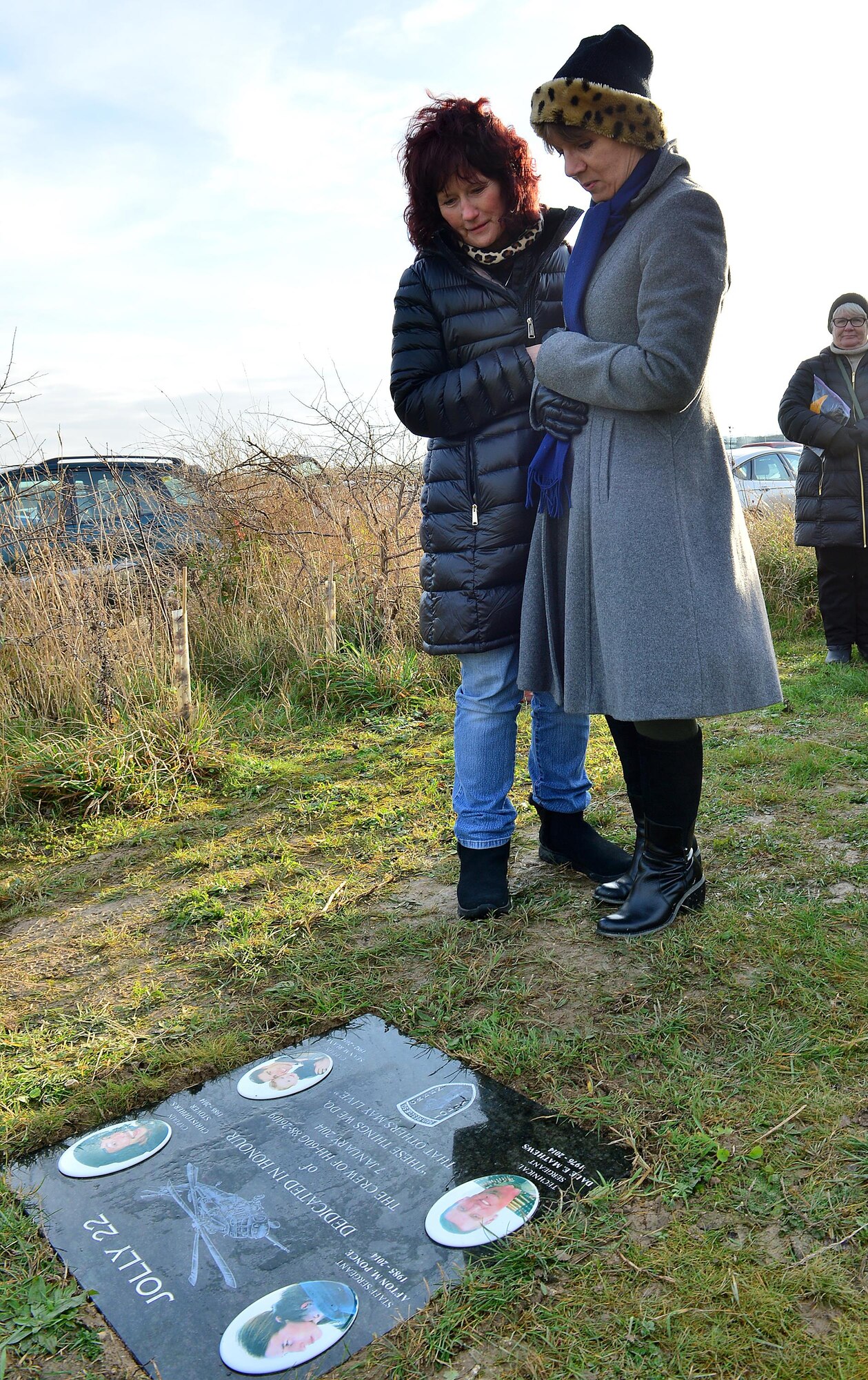 Marcia Ruane, mother of Capt. Sean Ruane, and Annette Hudson, Eastern Daily Press graphic journalist, view the memorial stone following the dedication ceremony Jan. 6, 2017. Hudson designed the memorial stone dedicated to the four fallen Airmen of Jolly 22 who perished on Jan. 7, 2014. (U.S. Air Force photo/Staff Sgt. Stephanie Longoria)