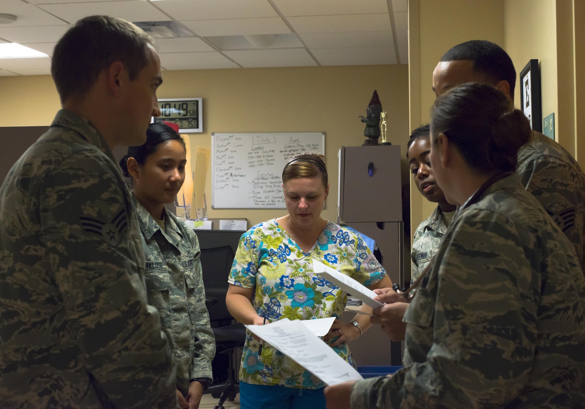 Aerospace medical technicians from the 6th Medical Group meet with primary care managers at the Family Health Clinic during a medical huddle. Medical huddles are conducted at least twice-daily to ensure patients receive the best care at MacDill Air Force Base, Fla., Jan. 3, 2017. (U.S. Air Force photo by Senior Airman Bradley Tipton)
